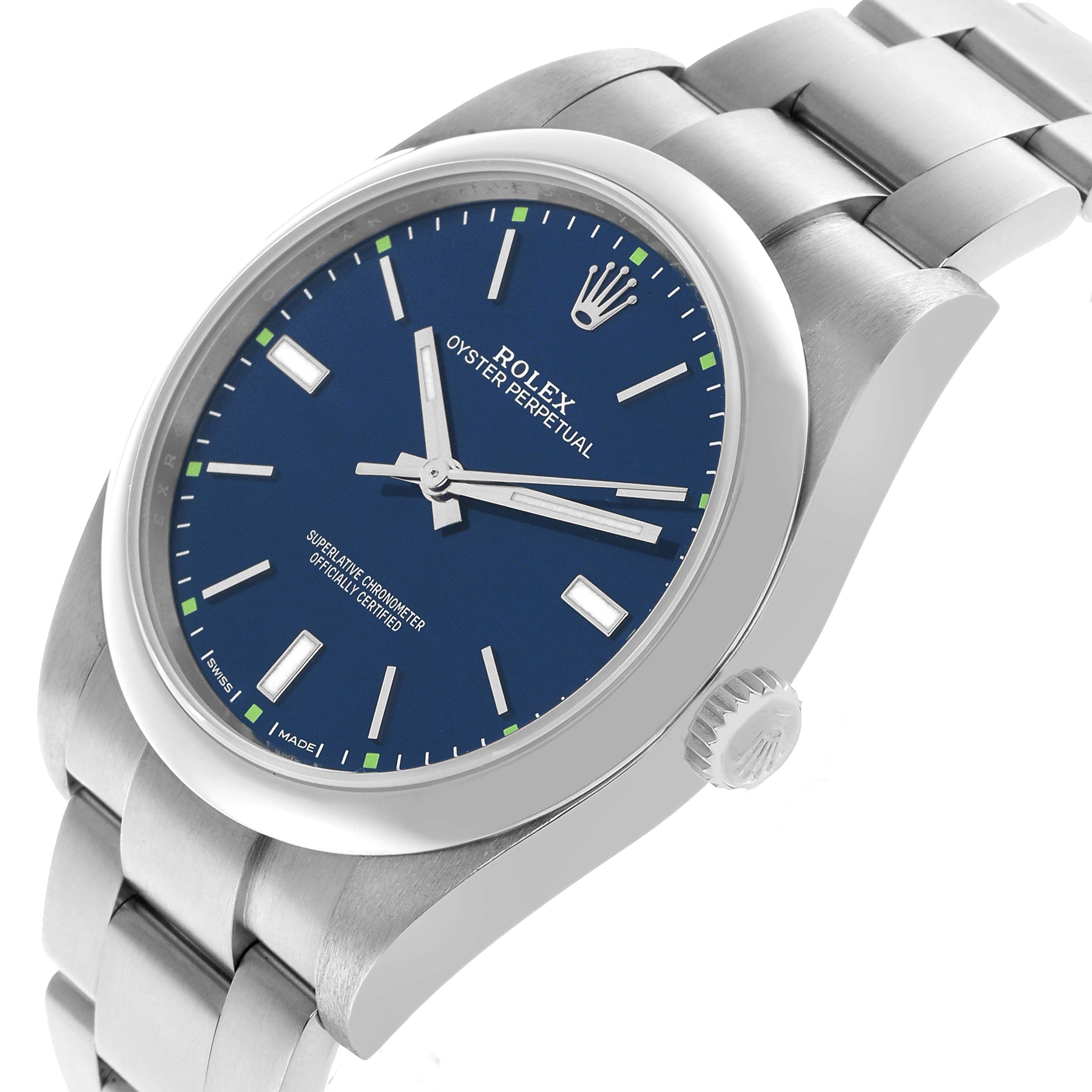 The Rolex Oyster Perpetual 114300 Men's Stainless Steel Blue Dial watch is shown at a slight angle, displaying the watch face, crown, and part of the bracelet.