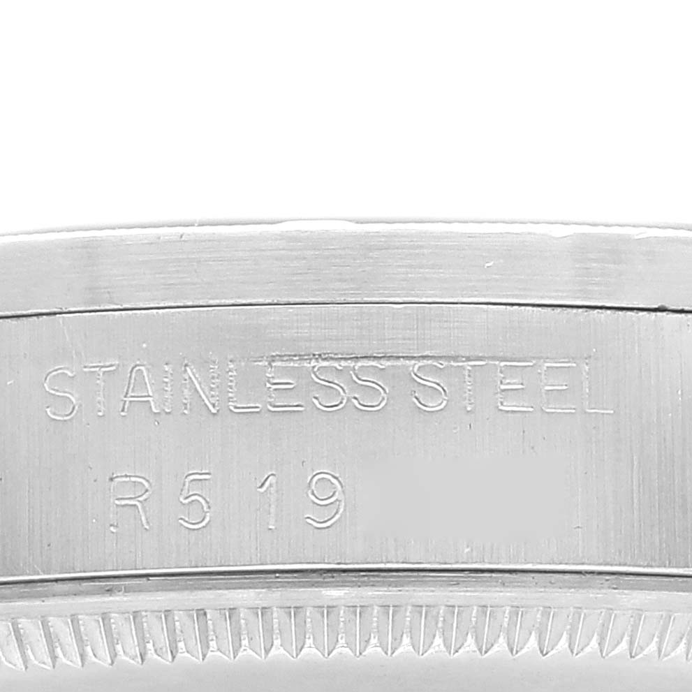 This image shows the edge of a stainless steel bezel with engravings on a Rolex Vintage Collection 1007 Men's Stainless Steel Silver Dial 1007 Men's Stainless Steel Silver Dial watch.