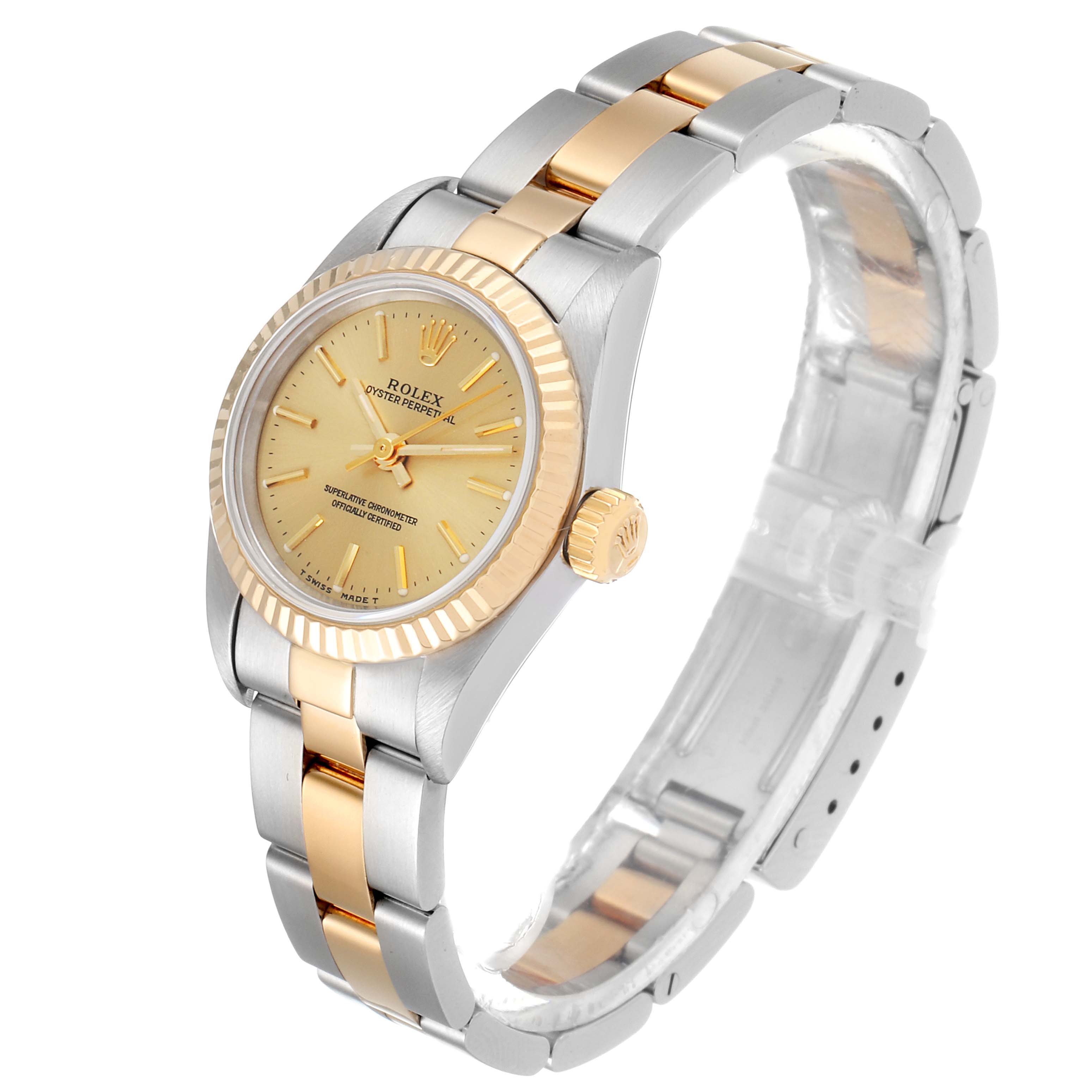 The Rolex Oyster Perpetual 67193 Women's Steel and Gold (two tone) Champagne Dial 67193 Women's Steel and Gold (two tone) Champagne Dial watch is shown at a 45-degree angle, highlighting its two-tone bracelet, bezel, and dial.