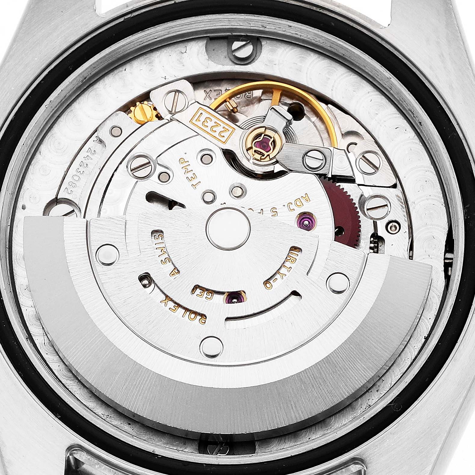 The image shows the internal mechanism of a Rolex Oyster Perpetual 177200 Women's Stainless Steel White Dial watch, focusing on its intricate movement components.