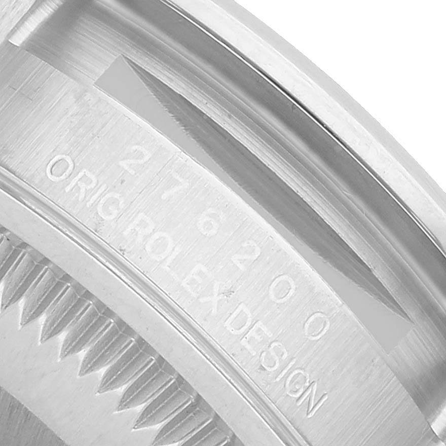 The image shows a close-up of the inner bezel with engravings on a Rolex Oyster Perpetual 276200 Women's Stainless Steel Pink Dial watch.