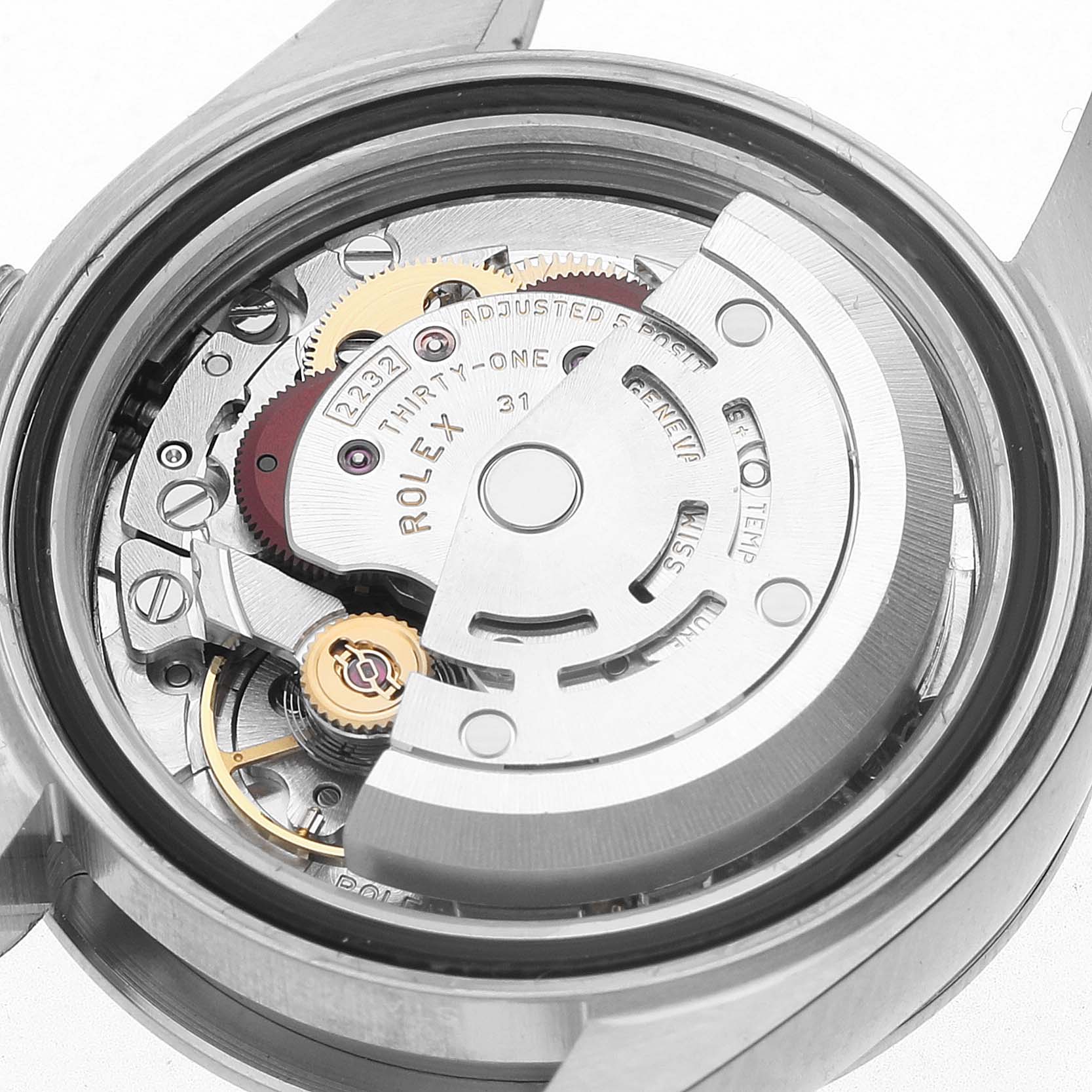 The image shows the back view of a Rolex Oyster Perpetual 276200 Women's Stainless Steel Pink Dial, featuring its intricate mechanical movement components.