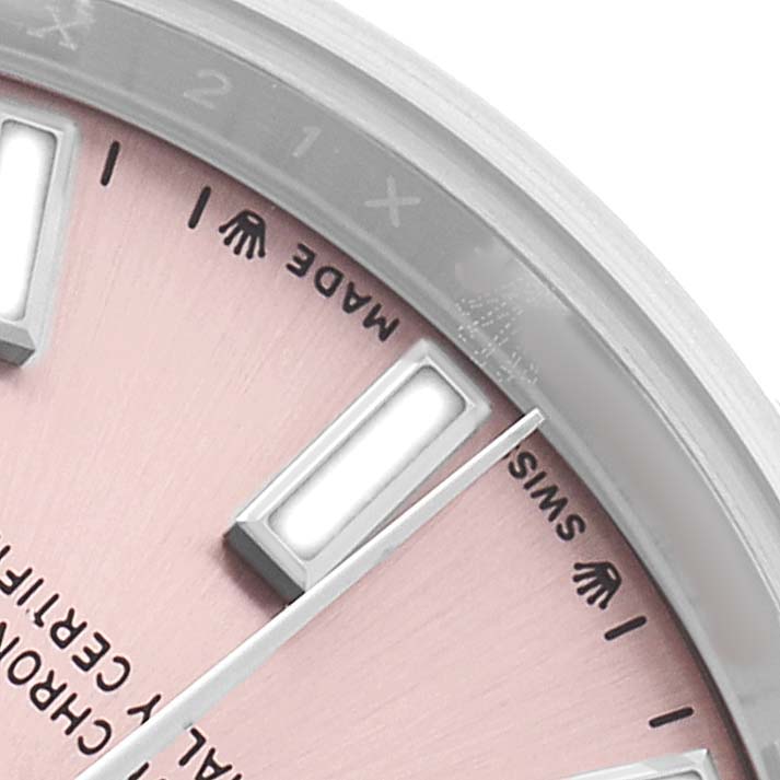 The image shows a close-up of the dial of a Rolex Oyster Perpetual 276200 Women's Stainless Steel Pink Dial watch, highlighting the markers and part of the bezel.