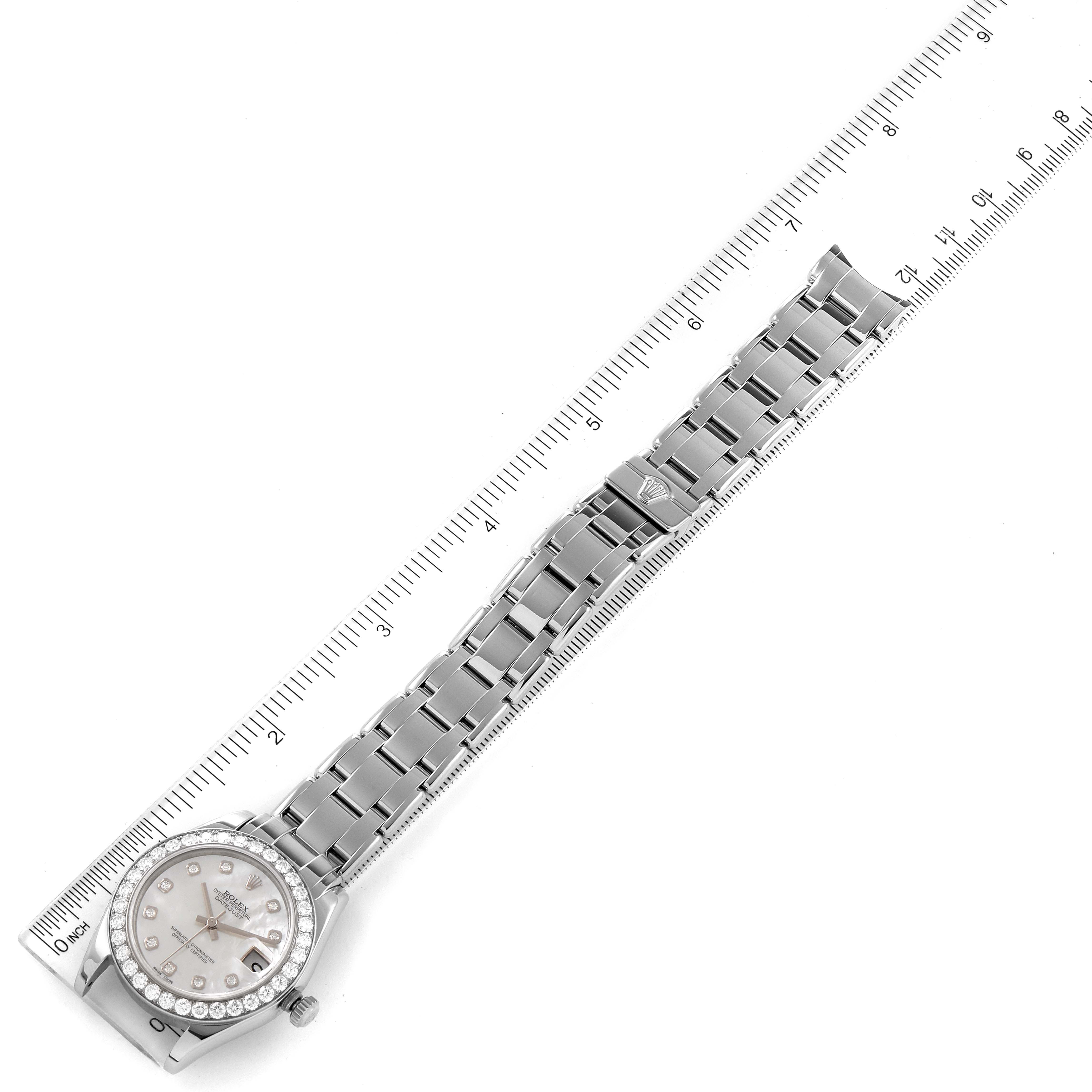 The image shows a top-down view of a Rolex Pearlmaster 81285 Women's White Gold Mother of Pearl Dial 81285 Women's White Gold Mother of Pearl Dial watch including its face, bezel, and bracelet with an adjacent ruler.