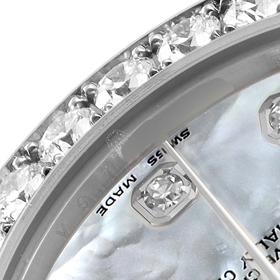The image shows a close-up of the bejeweled bezel and part of the dial of a Rolex Pearlmaster 81285 Women's White Gold Mother of Pearl Dial 81285 Women's White Gold Mother of Pearl Dial watch from an angled perspective.