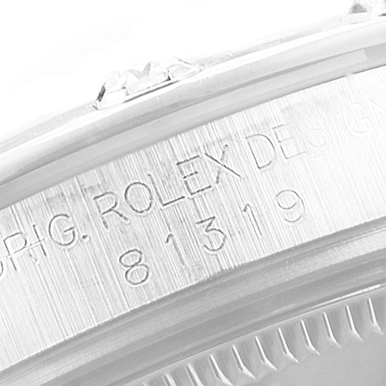 This is a close-up view of the engravings on the side of the bezel of a Rolex Pearlmaster 81319 Women's White Gold Mother of Pearl Dial 81319 Women's White Gold Mother of Pearl Dial watch.
