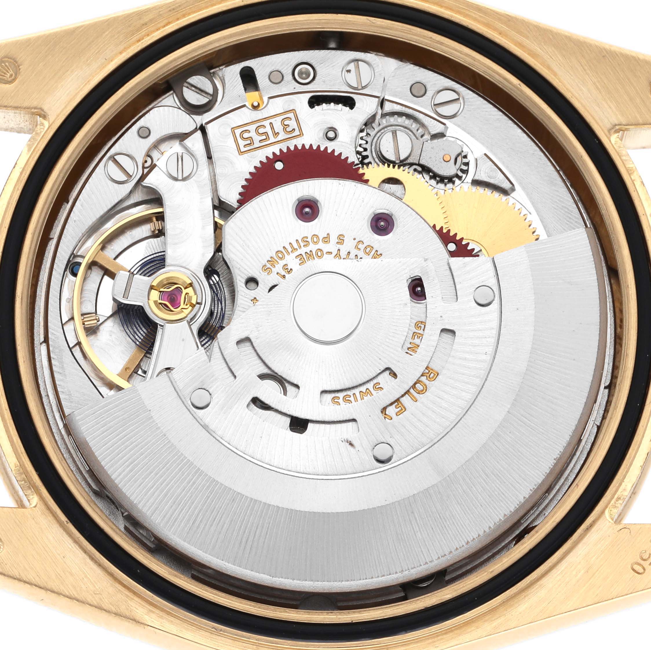 The image shows the movement of a Rolex President 118388 Men's Yellow Gold Champagne Dial 118388 Men's Yellow Gold Champagne Dial watch, revealing gears and mechanisms from the back angle.