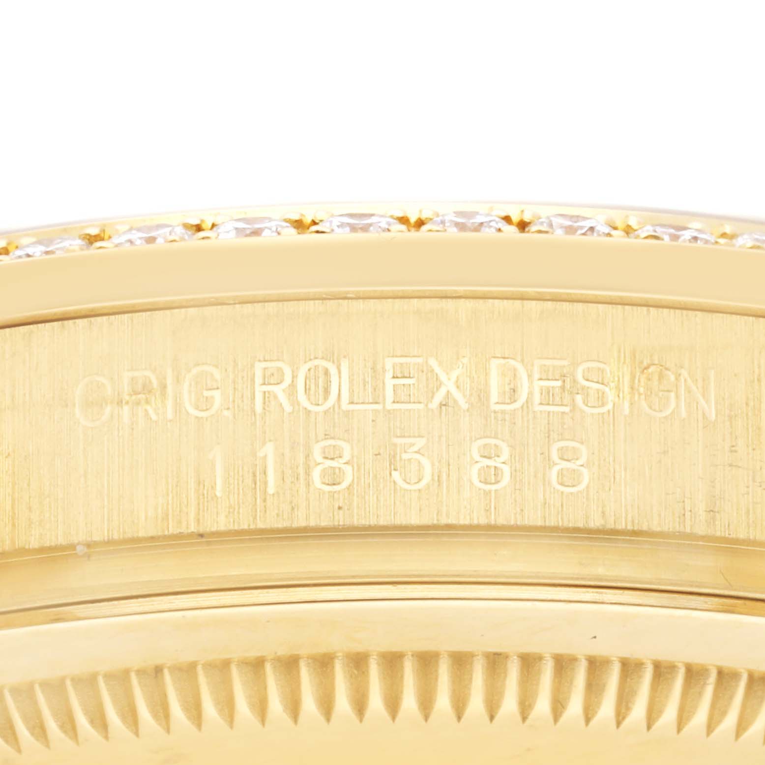 The image shows a detailed close-up of the side of a Rolex President 118388 Men's Yellow Gold Champagne Dial 118388 Men's Yellow Gold Champagne Dial watch, highlighting the engraved model number and bezel edge.