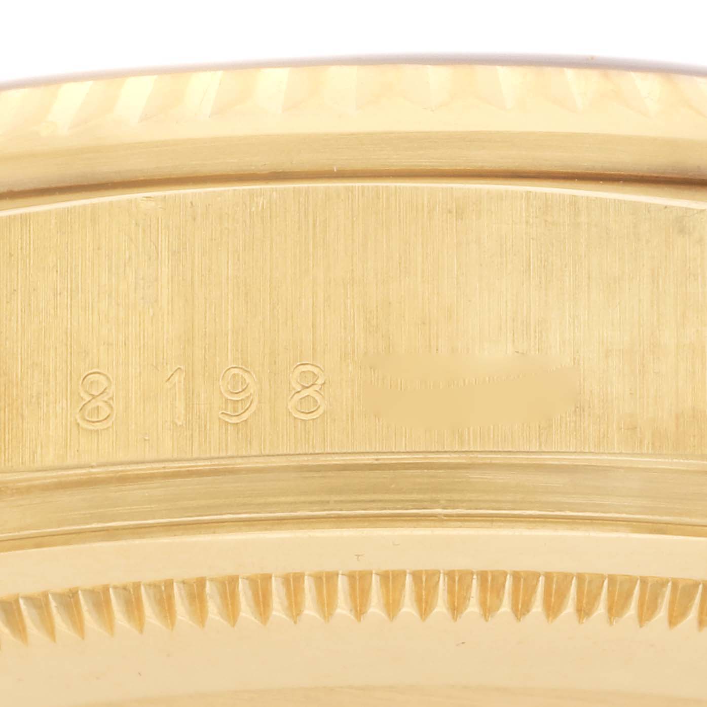 The image shows a close-up of the case's engraved numbers on the Rolex President 18038 Men's Yellow Gold Champagne Dial 18038 Men's Yellow Gold Champagne Dial model.