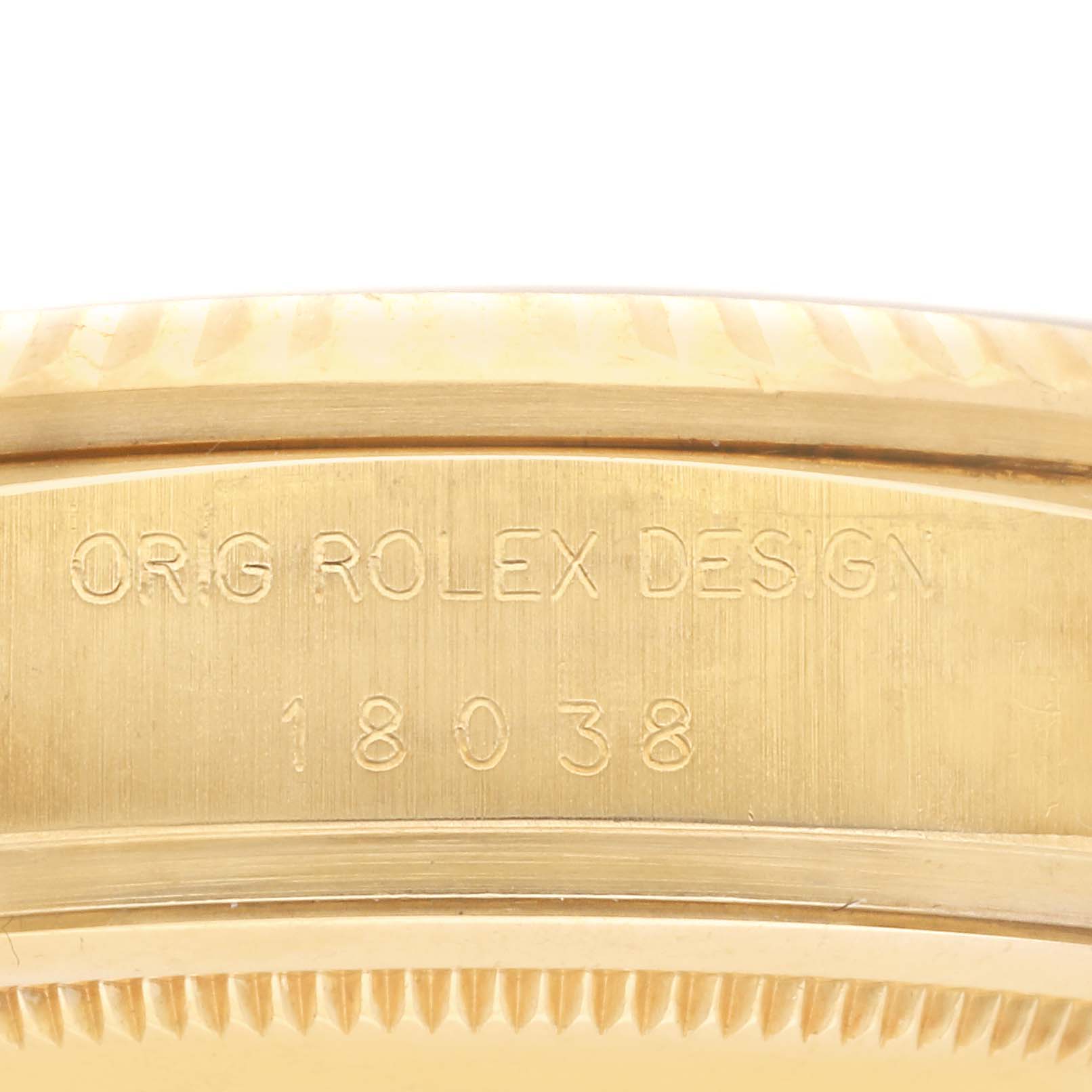 The image shows the side view of a Rolex President 18038 Men's Yellow Gold Champagne Dial 18038 Men's Yellow Gold Champagne Dial model, focusing on the engraved case marking.