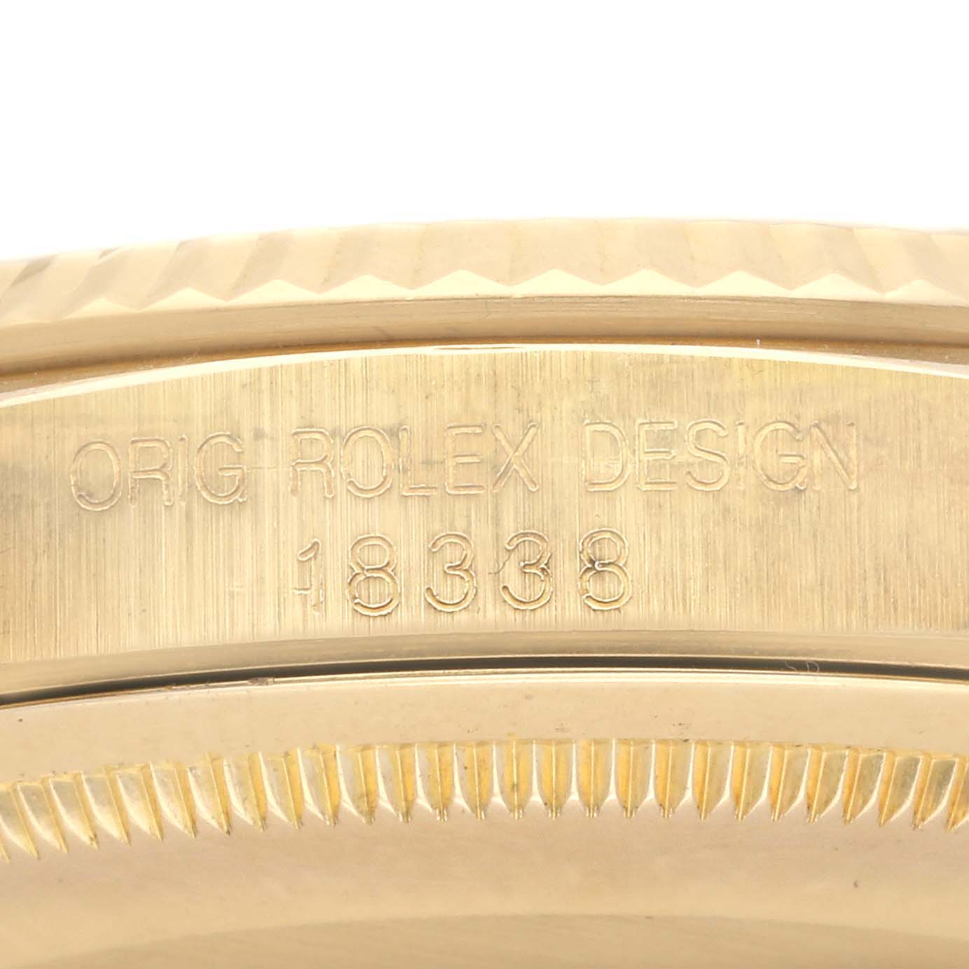 The image shows a close-up of the case side with engraved details on a Rolex President 18338 Men's Yellow Gold Champagne Dial 18338 Men's Yellow Gold Champagne Dial watch model.