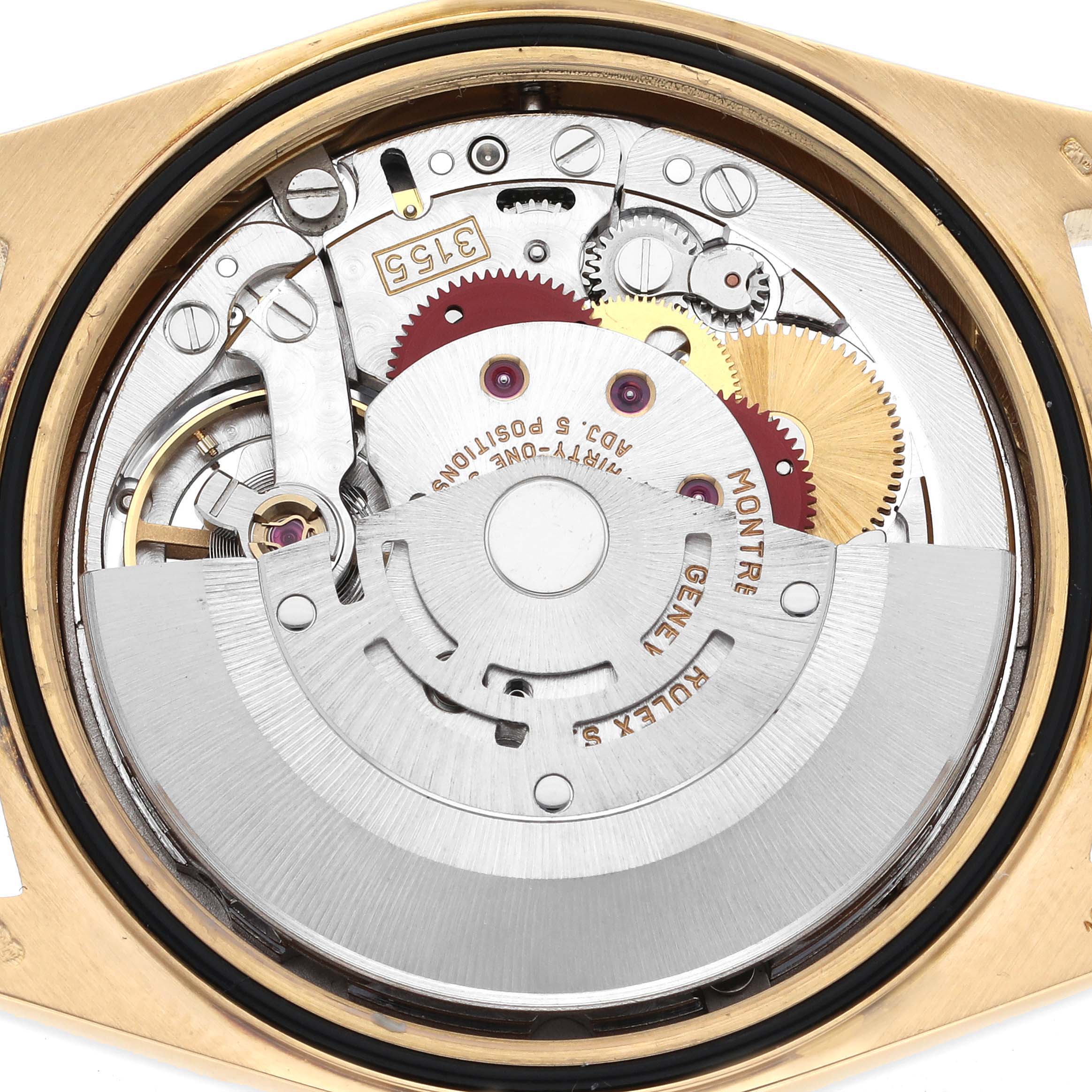 The image shows the internal movement of a Rolex President 18338 Men's Yellow Gold Champagne Dial 18338 Men's Yellow Gold Champagne Dial watch, focusing on gears and rotor from a back view.