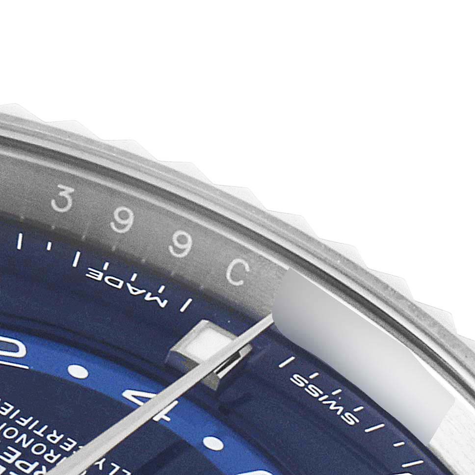 This image shows a close-up of the dial and part of the bezel of a Rolex Sky-Dweller 326934 Men's Stainless Steel Blue Dial 326934 Men's Stainless Steel Blue Dial watch.