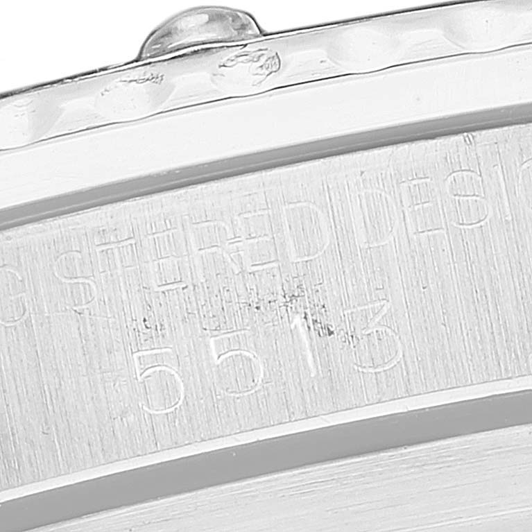 The image shows a close-up of the case back of a Rolex Vintage Collection 5513 Men
s Stainless Steel Black Dial 5513 Men
s Stainless Steel Black Dial model, highlighting the engraved serial number and part of the bezel.