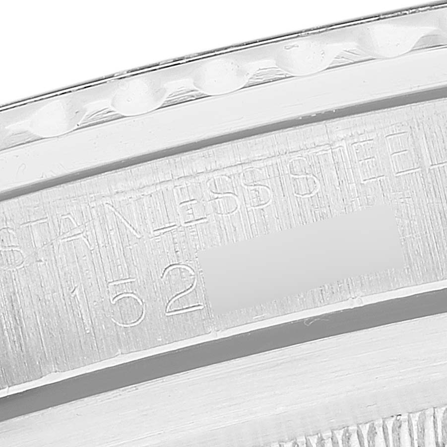 The image shows a close-up of the engraved stainless steel casing back edge of a Vintage Collection model by Rolex.
