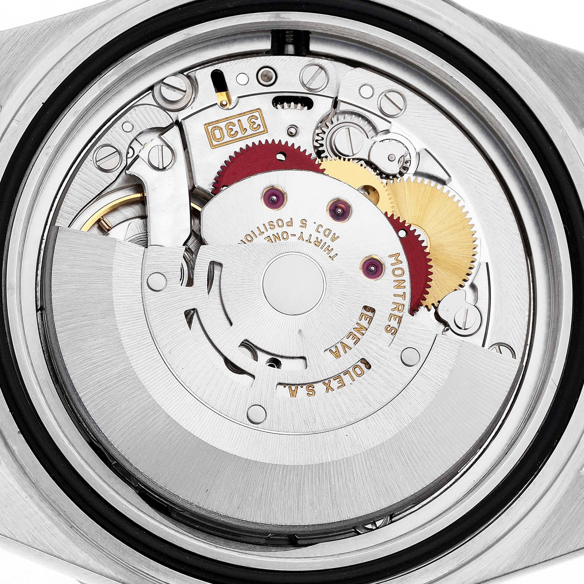 The image shows a close-up of the Rolex Submariner 14060M Men's Stainless Steel Black Dial's movement, highlighting gears, rotors, and intricate mechanisms from a rear angle.