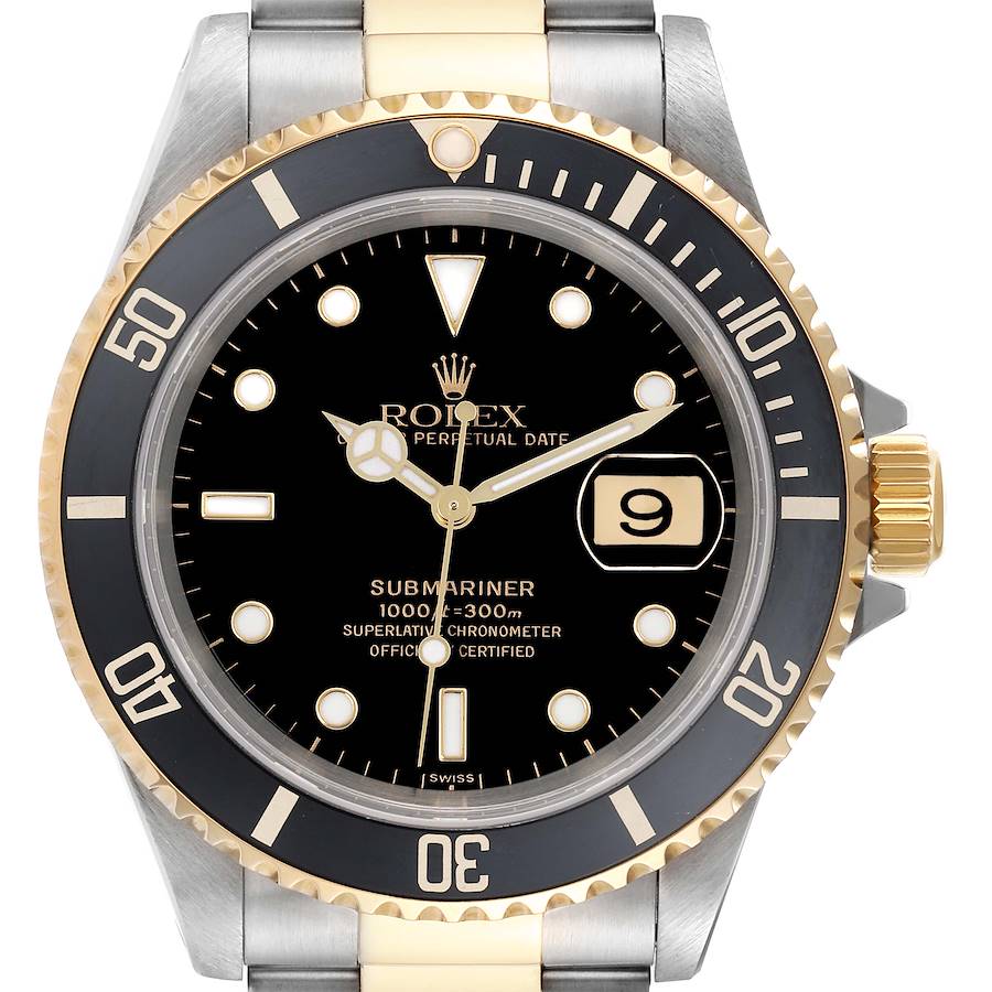 The Rolex Submariner watch is shown from a front angle, displaying its black dial, gold and steel bezel, and bracelet.