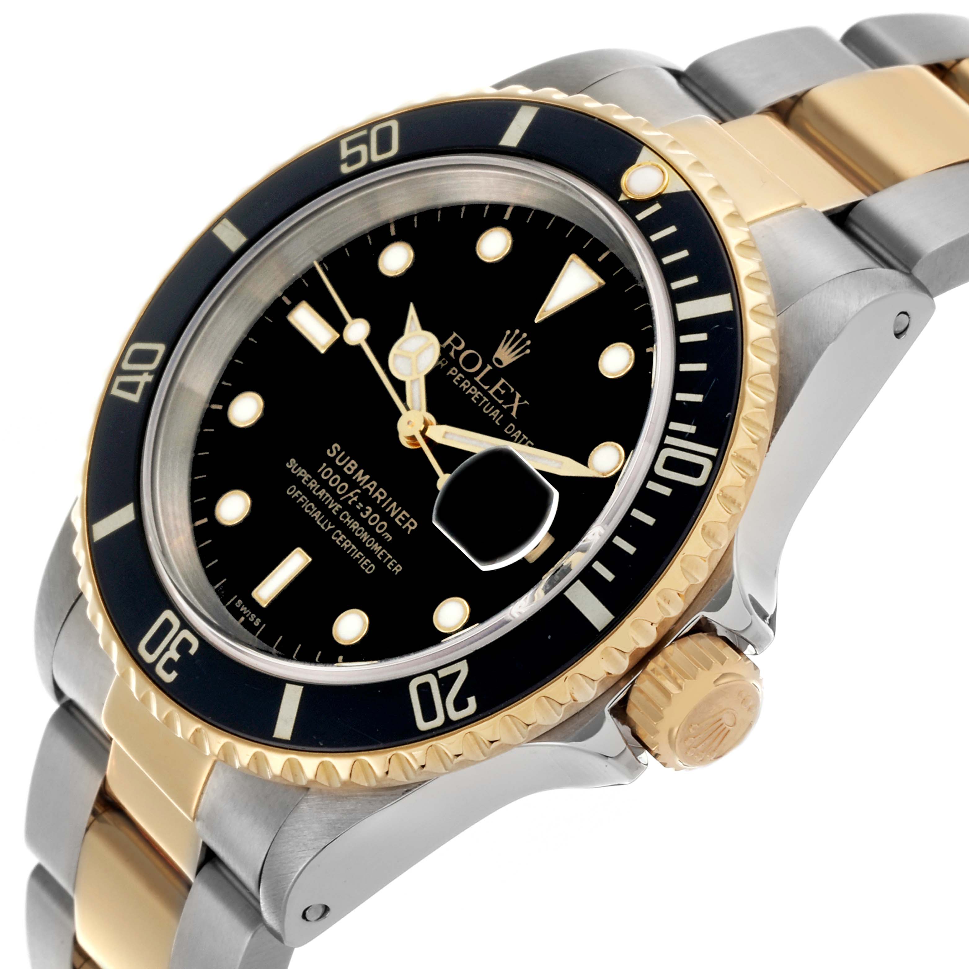 The Rolex Submariner 16613 Men's Steel and Gold (two tone) Black Dial 16613 Men's Steel and Gold (two tone) Black Dial watch is shown at a tilted angle, highlighting the dial, bezel, crown, and two-tone bracelet.