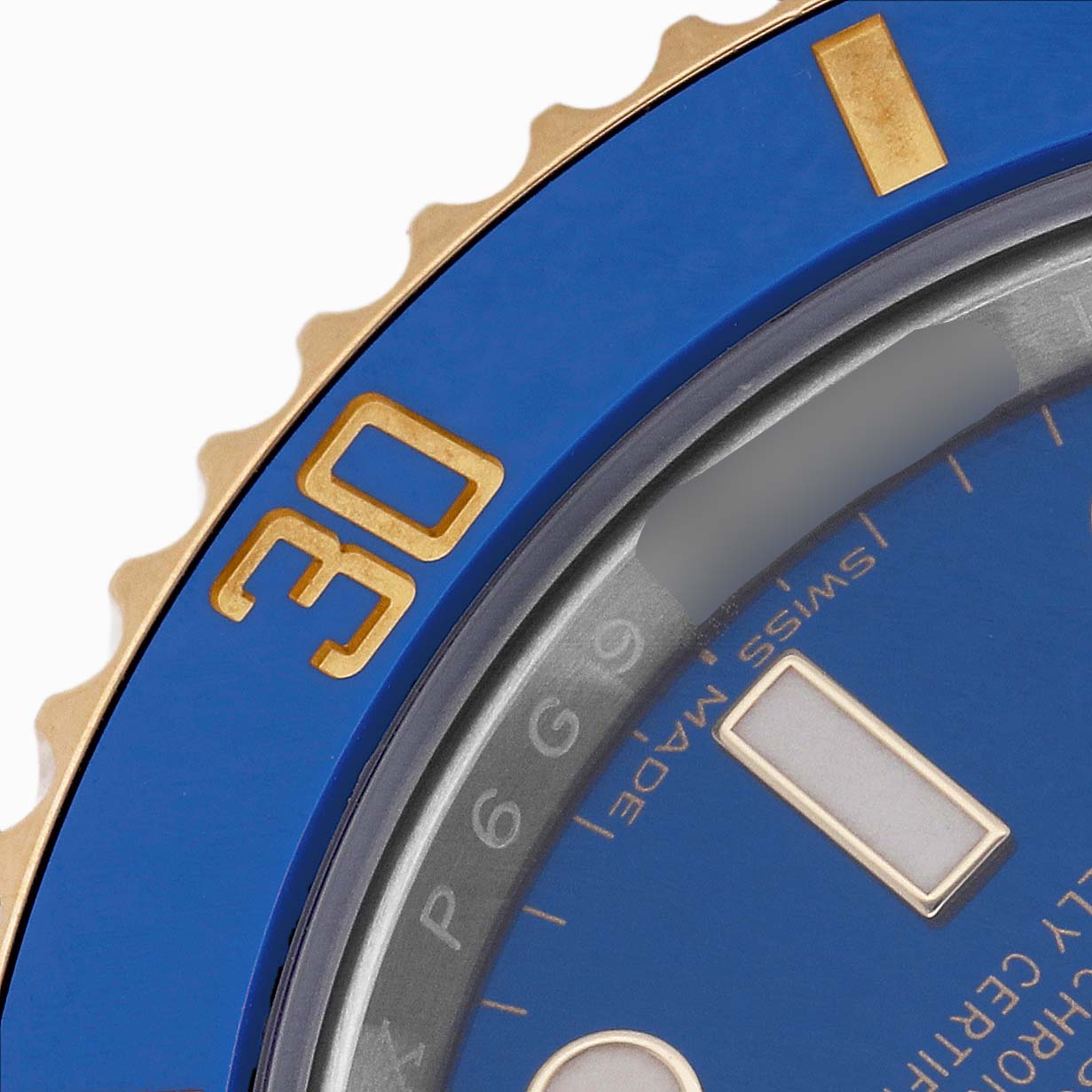 The image shows a close-up of the blue and gold bezel and dial of a Rolex Submariner 116613 Men's Steel and Gold (two tone) Blue Dial, highlighting the "30" mark.