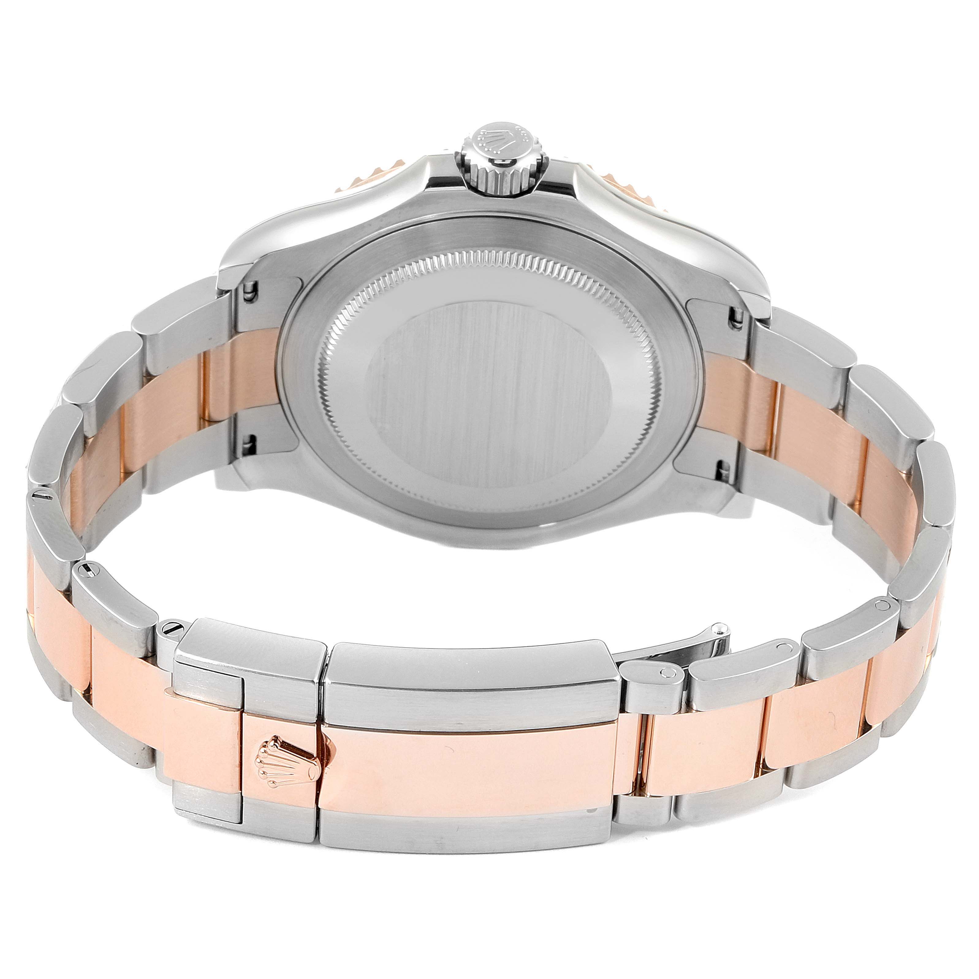 The image shows the back view of a Rolex Yacht-Master 116621 Men
s Steel and Gold (two tone) Black Dial 116621 Men
s Steel and Gold (two tone) Black Dial watch, focusing on the case back and two-tone bracelet.