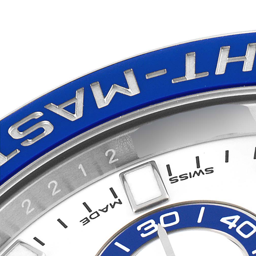 The image shows a close-up angle of the Rolex Yacht-Master 116680 Men
s Stainless Steel White Dial 116680 Men
s Stainless Steel White Dial watch, highlighting the bezel, part of the dial, and hour markers.