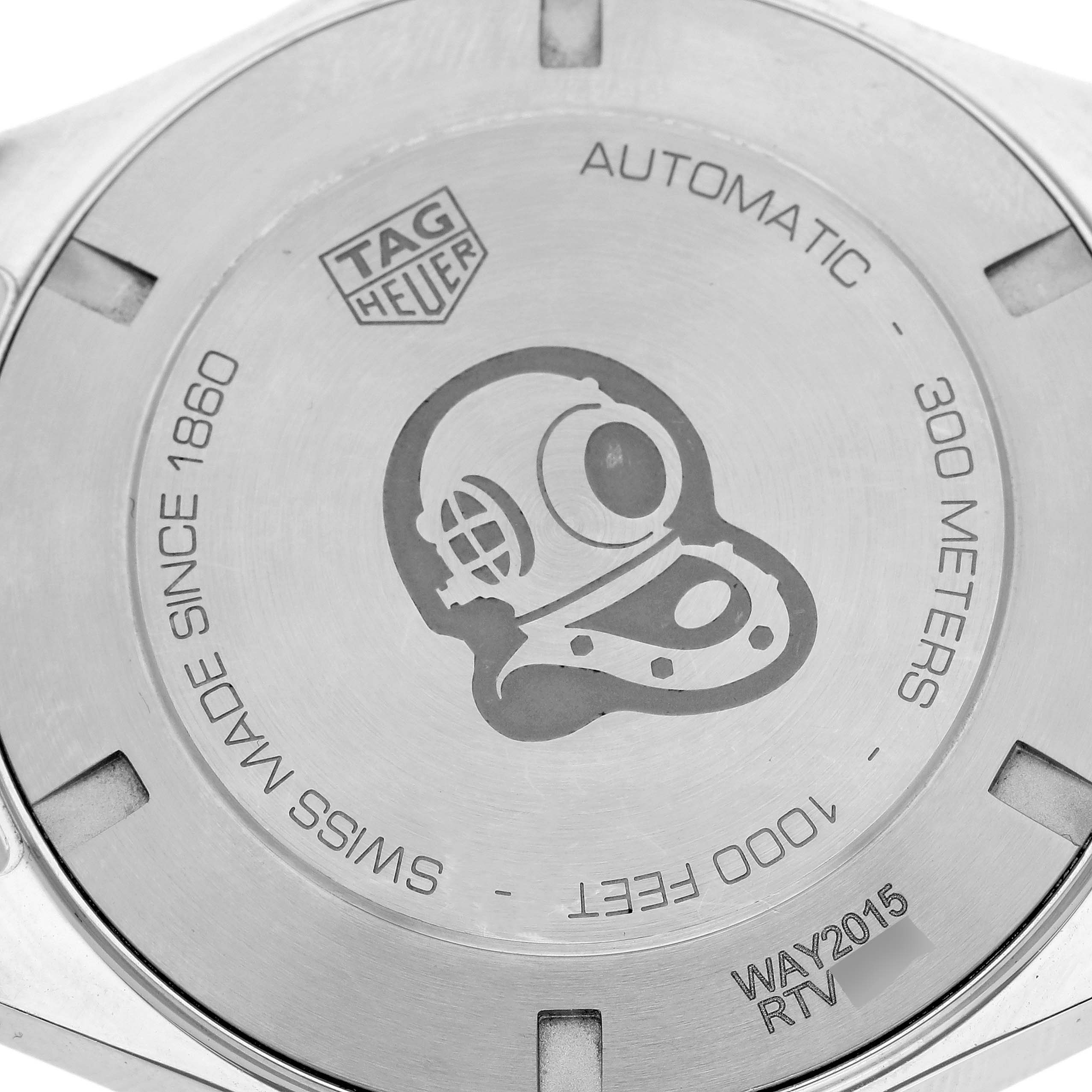 The image shows the back of a Tag Heuer Aquaracer WAY2015.BA0927 Men's Stainless Steel Green Dial WAY2015.BA0927 Men's Stainless Steel Green Dial watch, featuring engravings and a diving helmet design.