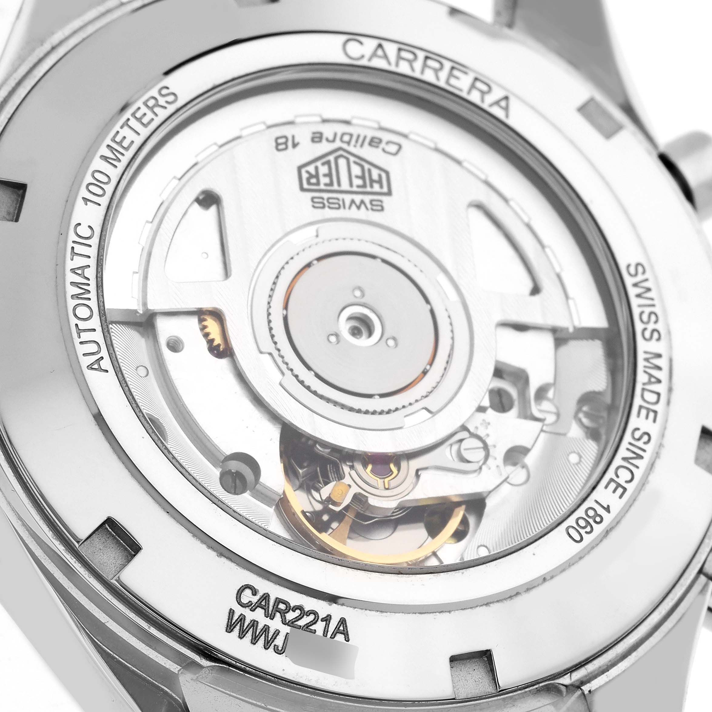 The image shows the back view of the Tag Heuer Carrera CAR221A.FC6353 Men's Stainless Steel White Dial CAR221A.FC6353 Men's Stainless Steel White Dial watch, highlighting its automatic movement and case details.