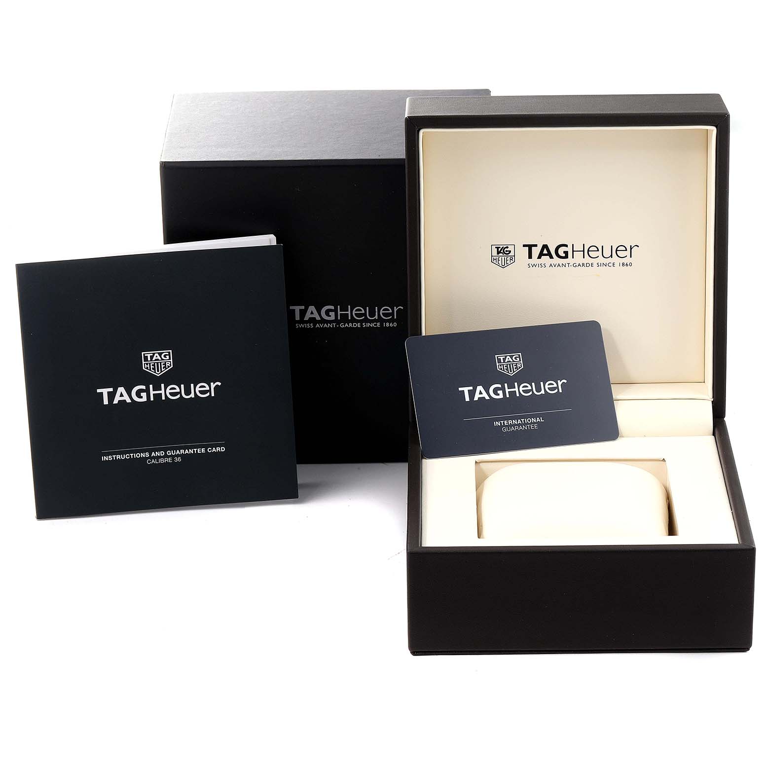 The image shows the packaging, instruction manual, and guarantee card for the Tag Heuer Carrera CAR2B11.BA0799 Men's Stainless Steel Grey Dial CAR2B11.BA0799 Men's Stainless Steel Grey Dial model.