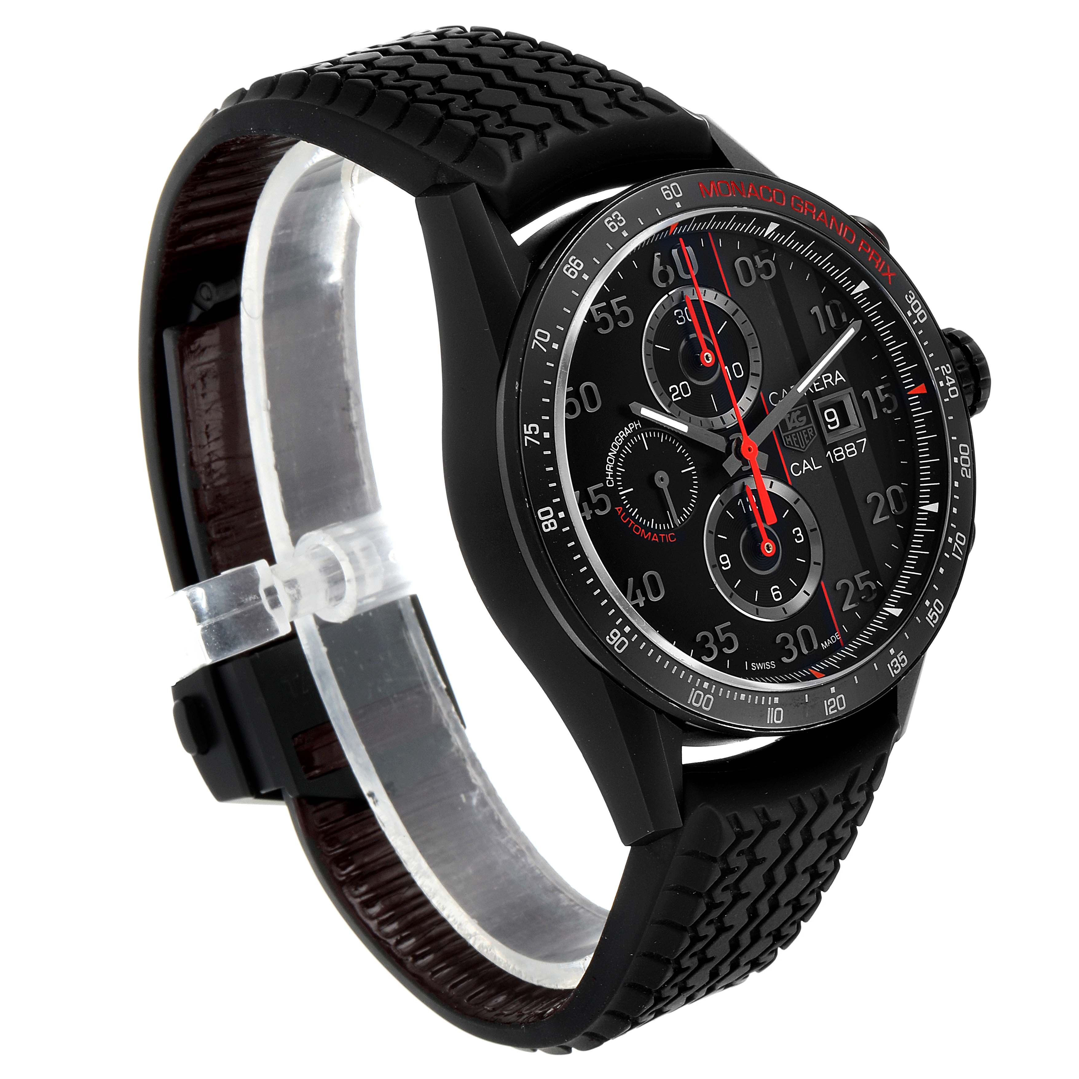 The image shows a Tag Heuer Carrera Calibre 1887 watch at an angle highlighting its dial, chronographs, and rubber strap.
