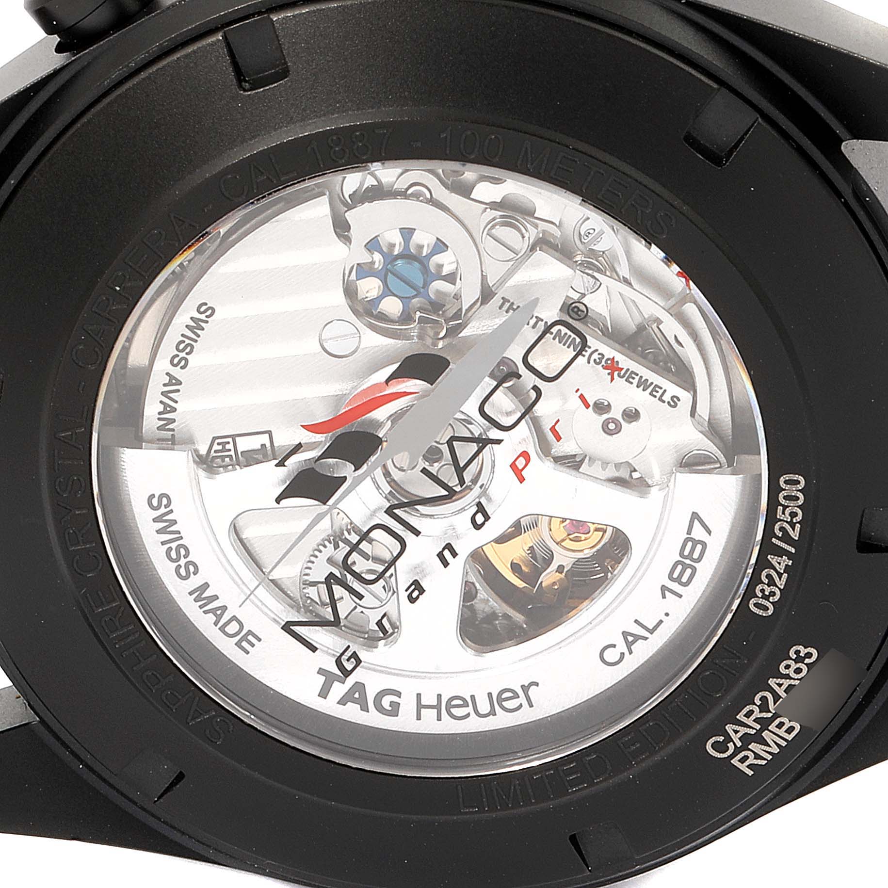 The image shows the back view of the Tag Heuer Monaco CAR2A83.FT6033 Men's Titanium Black Dial CAR2A83.FT6033 Men's Titanium Black Dial watch, including the movement and limited edition engravings.