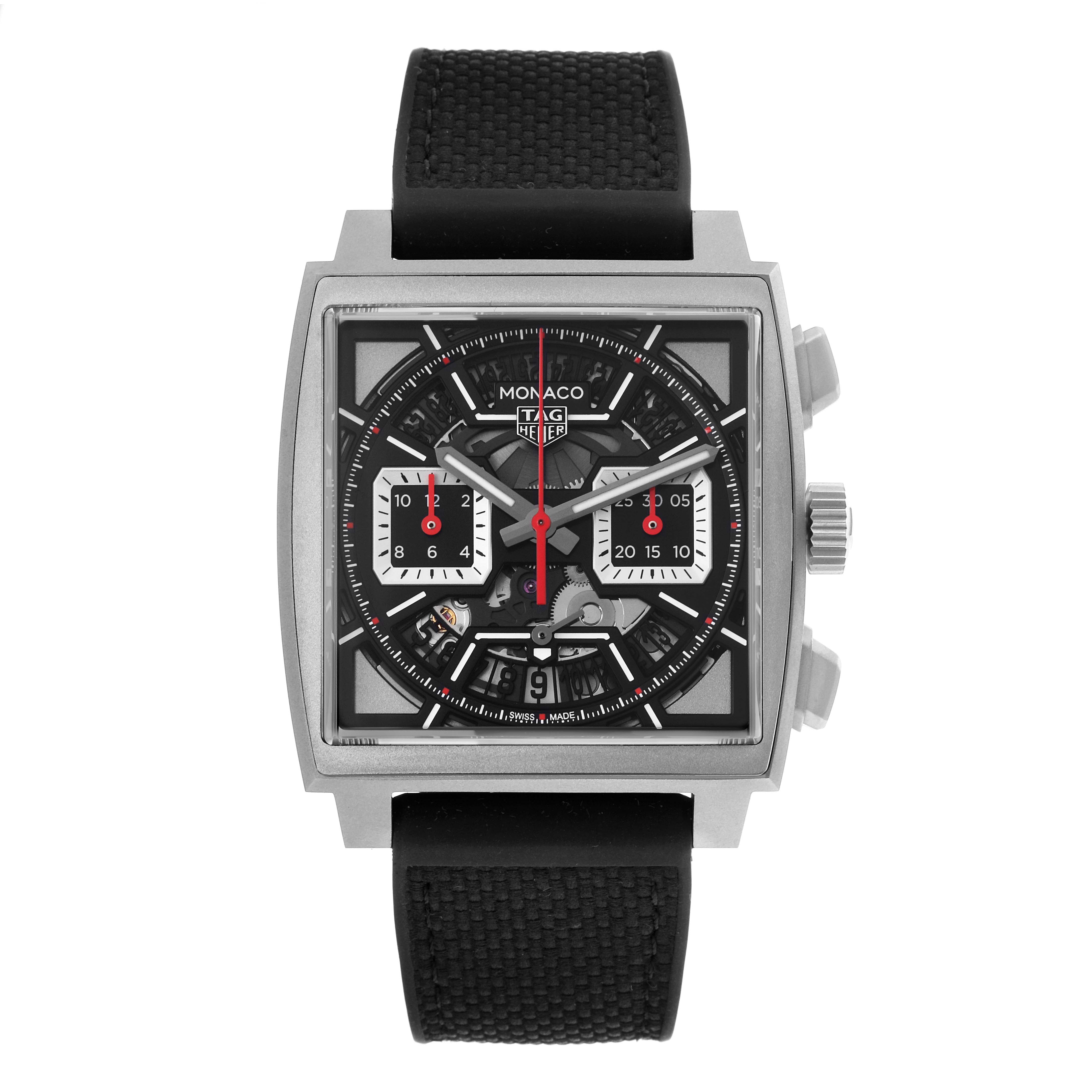 The Tag Heuer Monaco CBL2183.FT6236 Men's Titanium Black Dial CBL2183.FT6236 Men's Titanium Black Dial watch is shown from a front angle, highlighting its square face, chronograph subdials, and crown.