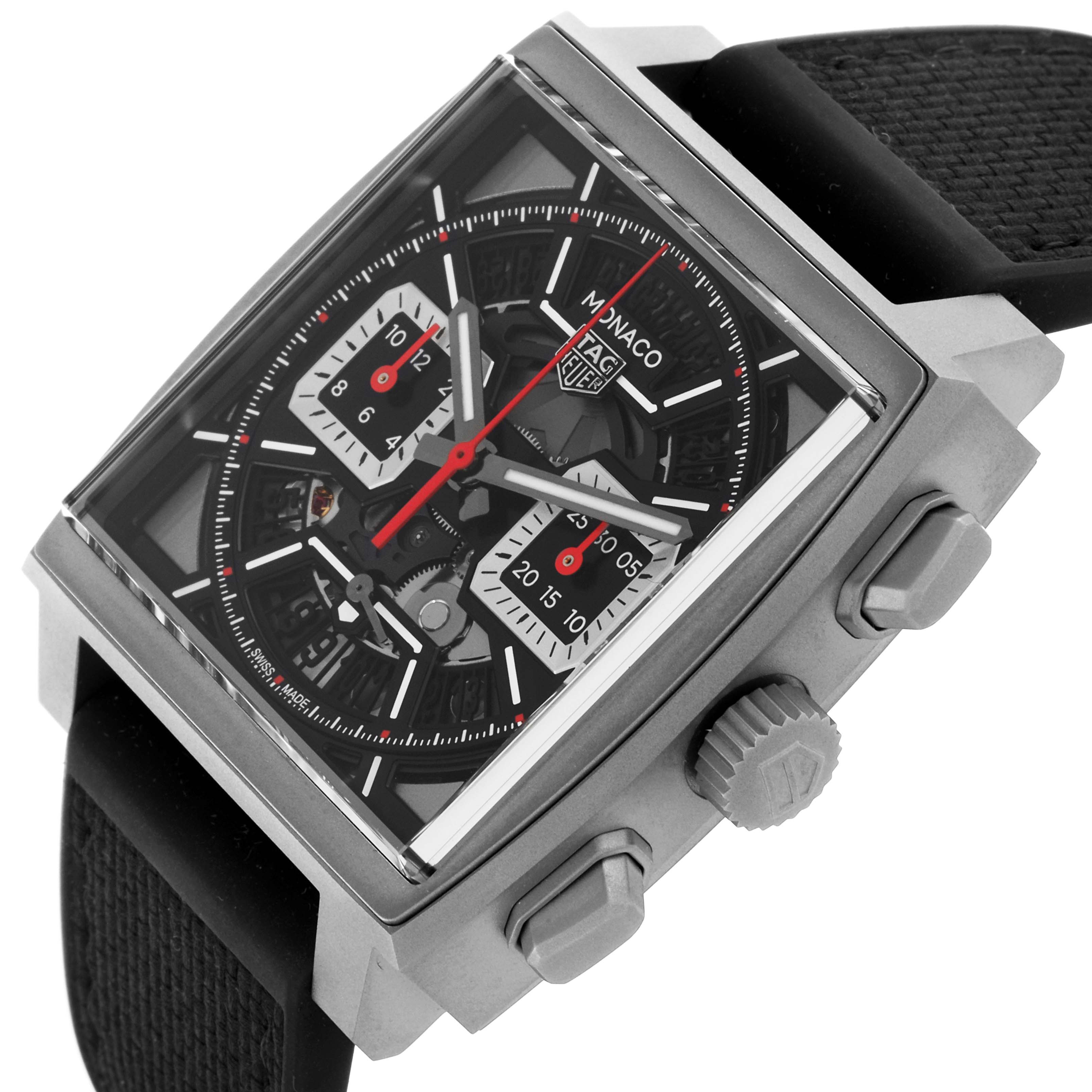 The Tag Heuer Monaco CBL2183.FT6236 Men's Titanium Black Dial CBL2183.FT6236 Men's Titanium Black Dial watch is shown from a front-side angle, highlighting the square face, dials, crown, and pushers.