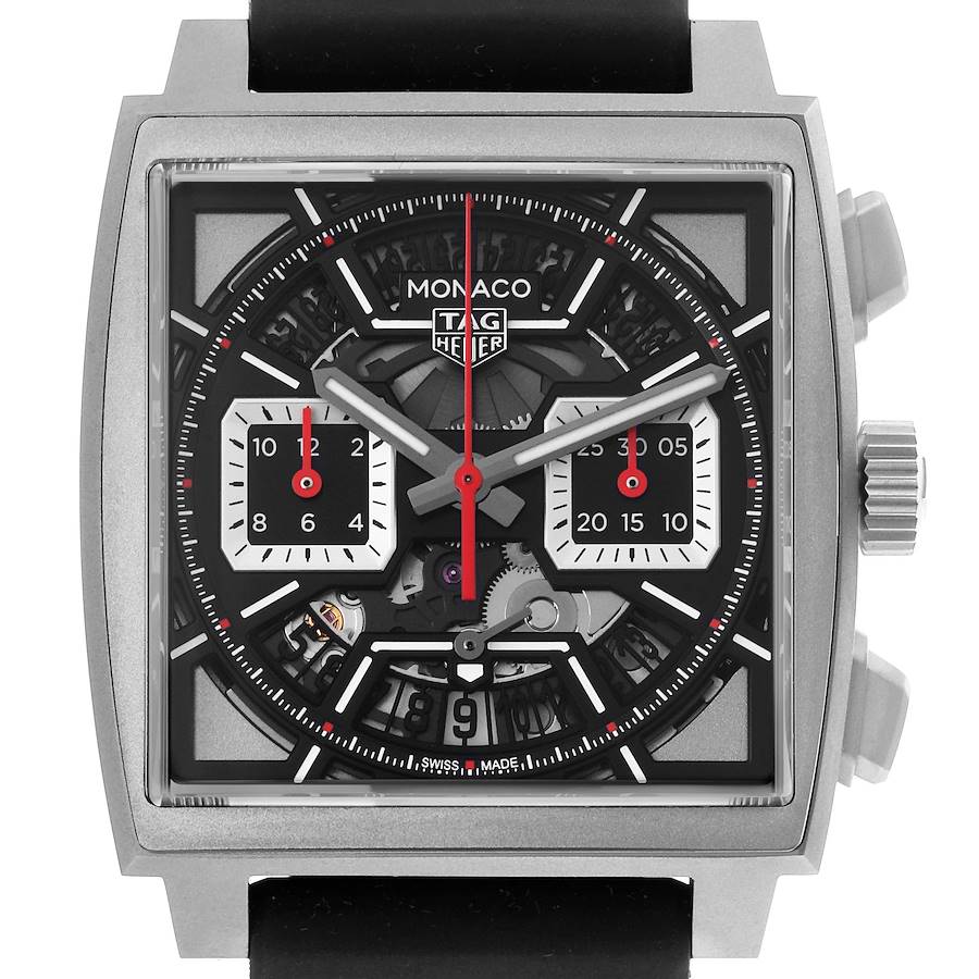 The TAG Heuer Monaco watch is shown from the front, highlighting its square face, dial details, and crown.
