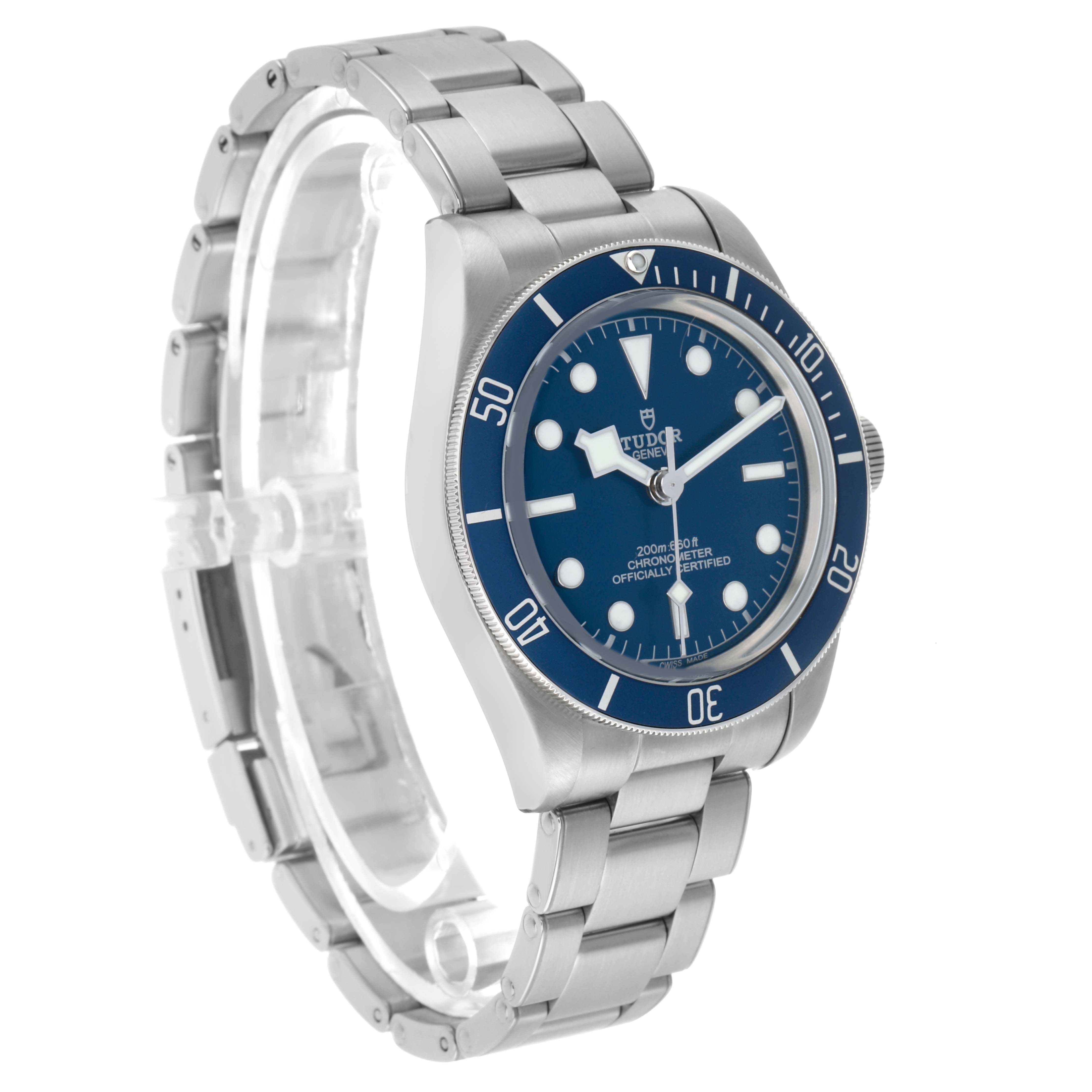 The Tudor Heritage Black Bay 79030B Men's Stainless Steel Blue Dial watch is shown at a three-quarter angle, highlighting its bezel, dial, and bracelet.