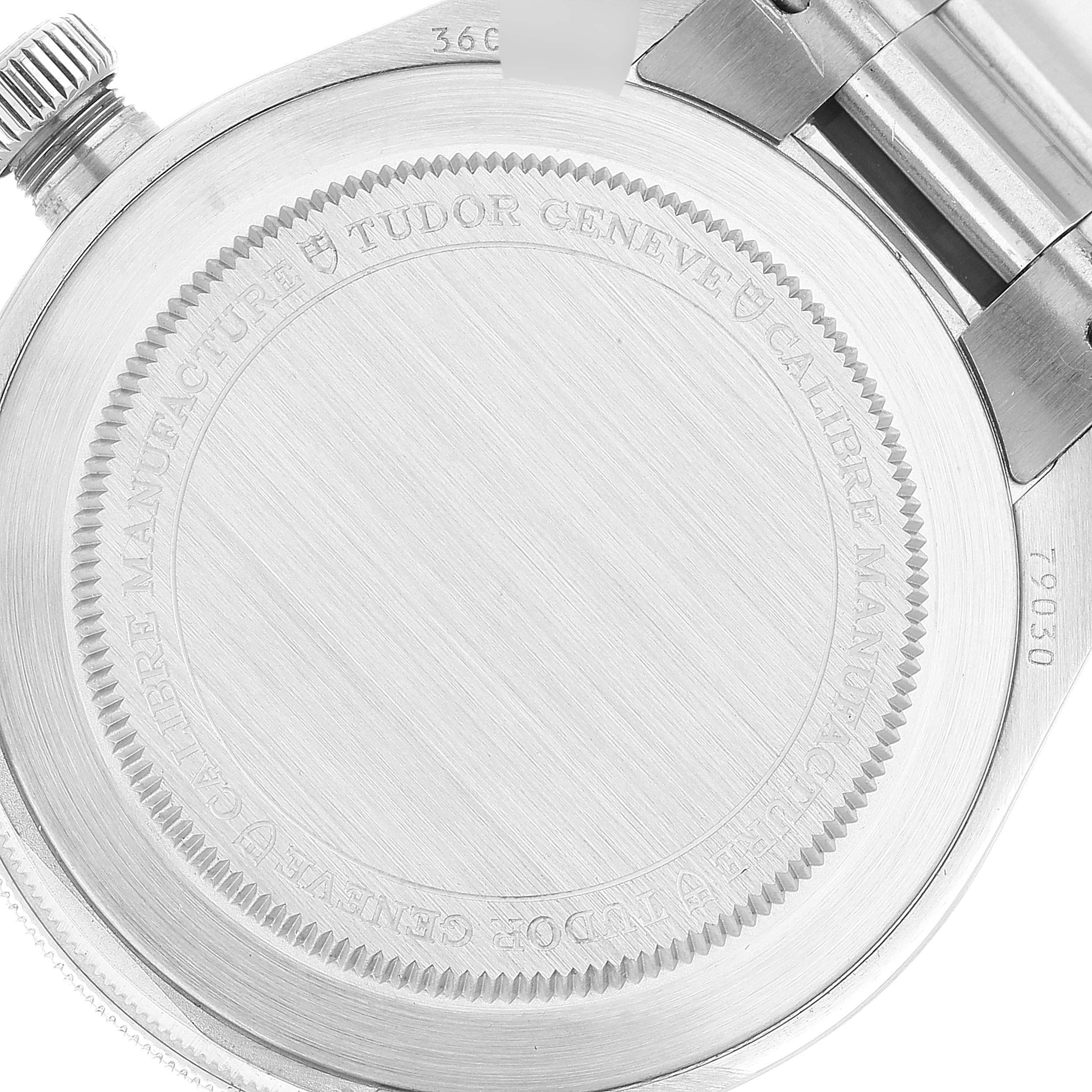 This image shows the case back and part of the bracelet of a Tudor Heritage Black Bay 79030B Men's Stainless Steel Blue Dial 79030B Men's Stainless Steel Blue Dial watch.