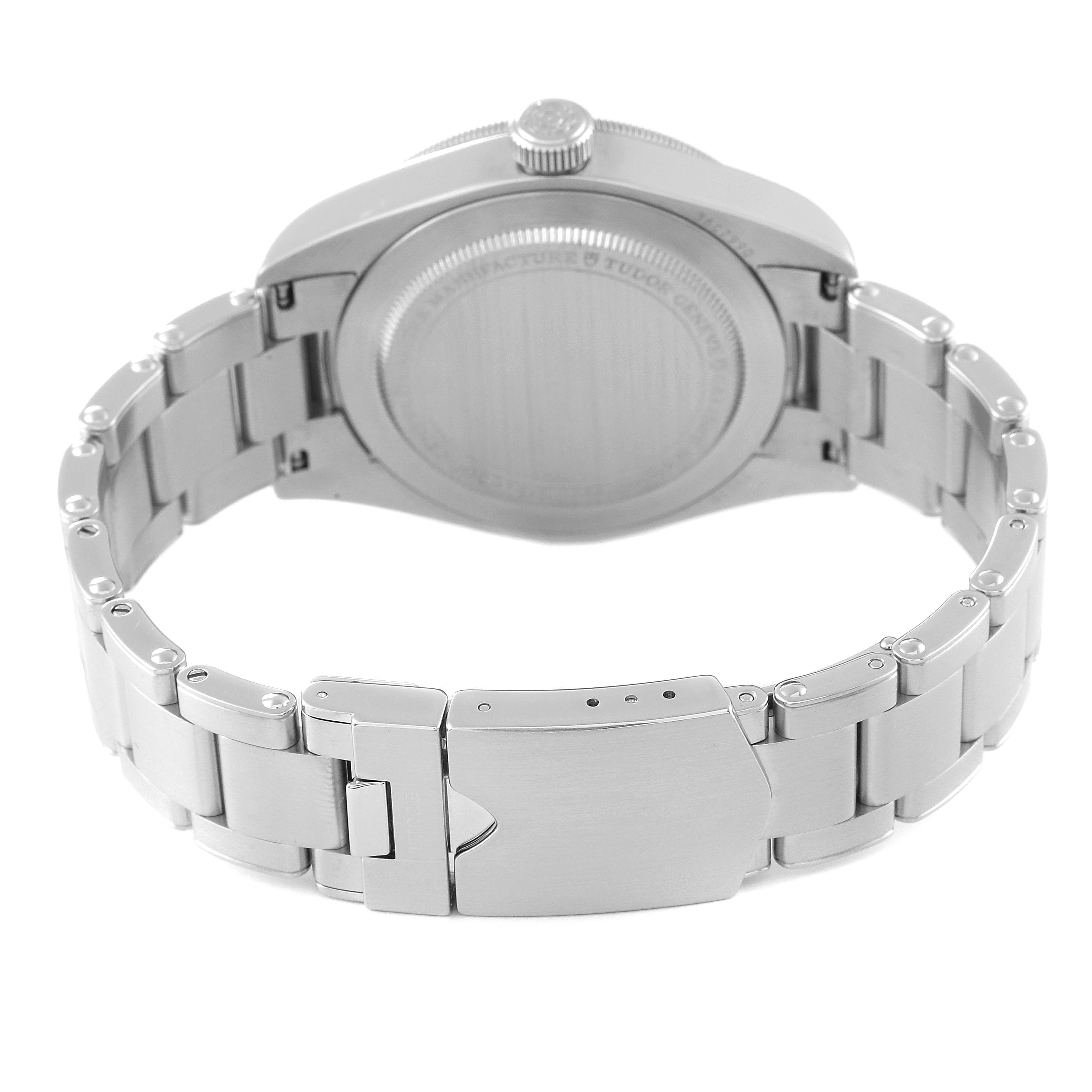 This image shows the Heritage Black Bay model by Tudor from a rear angle, highlighting the case back and metal bracelet with a clasp.