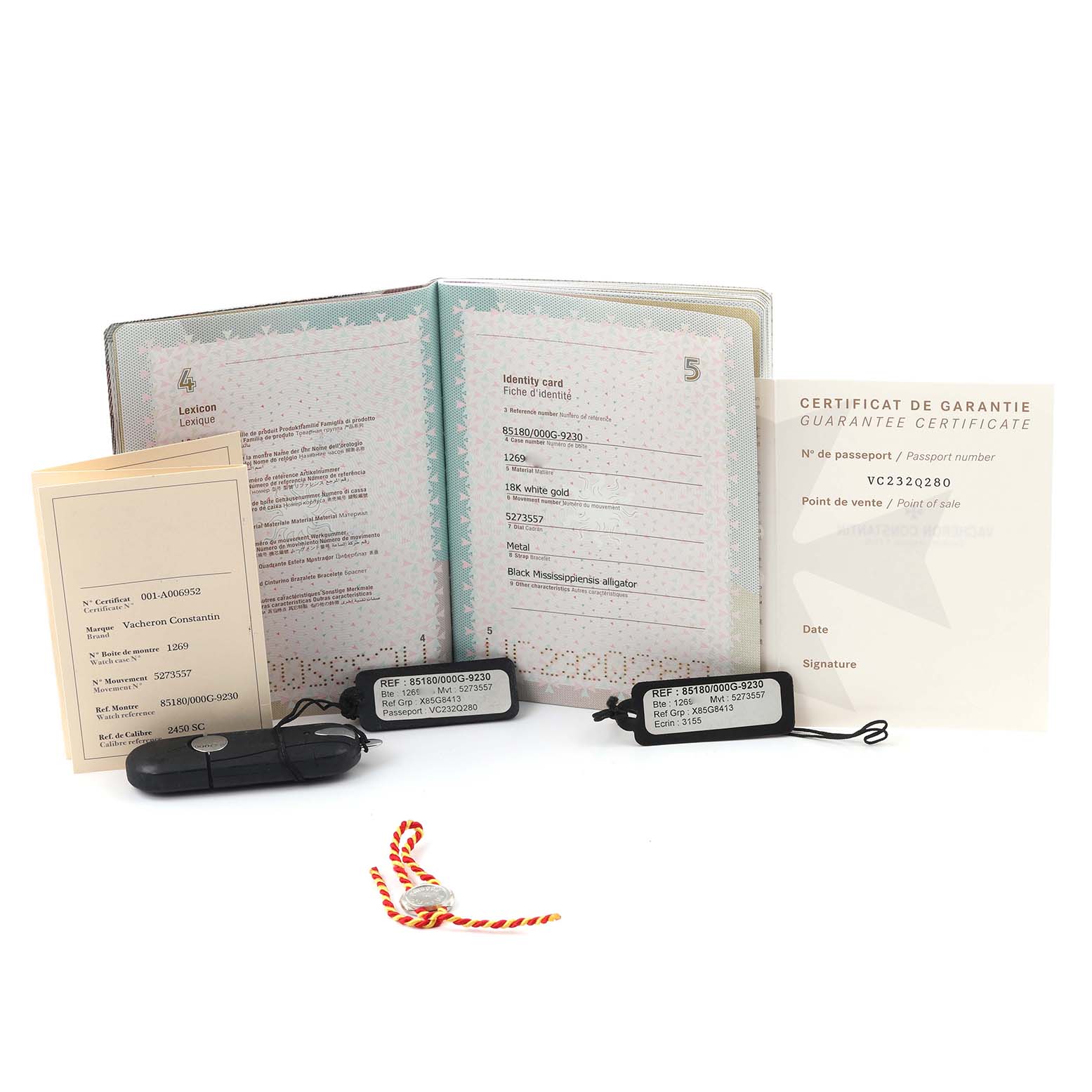 The image shows documentation and tags for a Vacheron Constantin Patrimony 85180/000G-9230 Men's White Gold Silver Dial 85180/000G-9230 Men's White Gold Silver Dial watch, including a guarantee certificate and identity card.