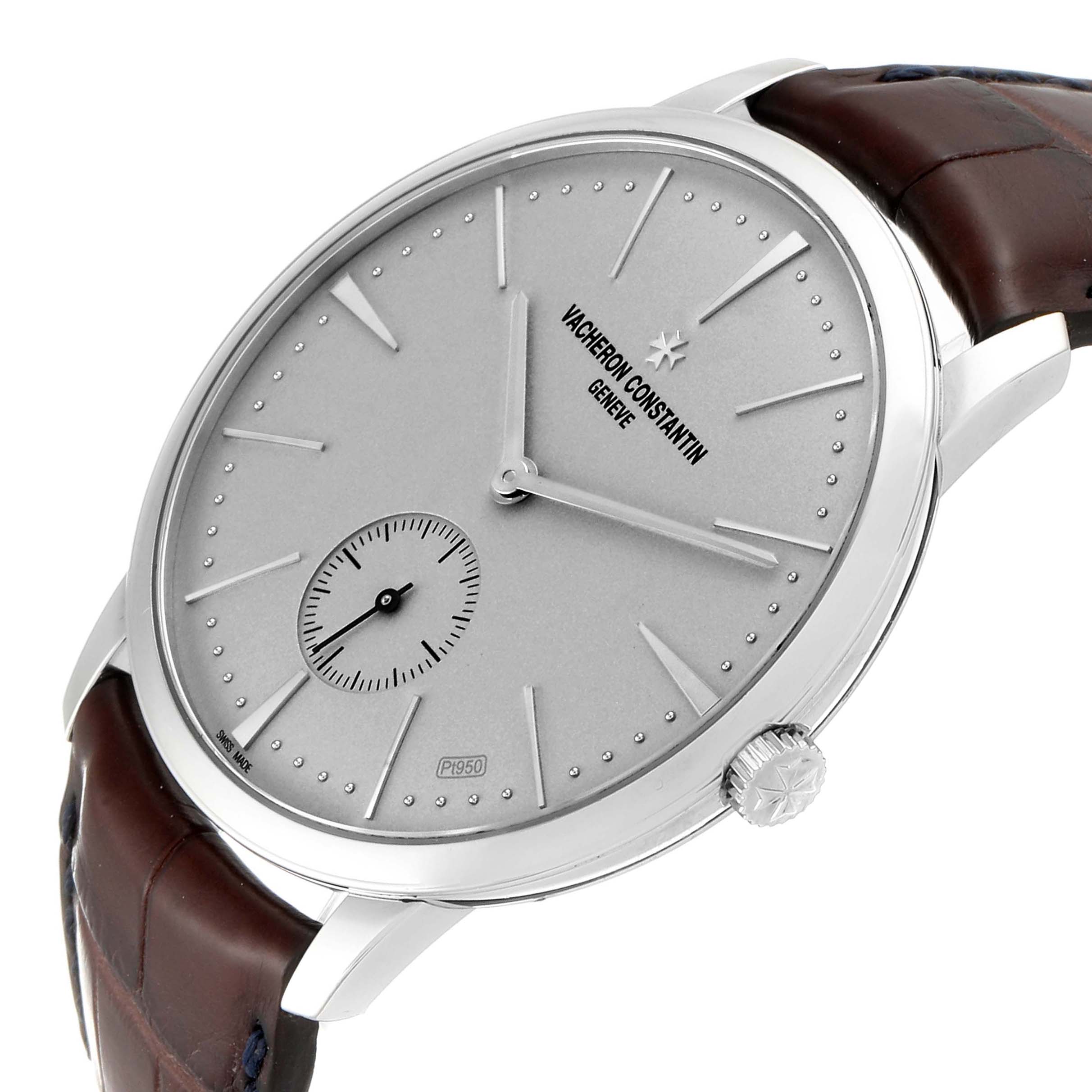 The image shows a side-angle view of the Vacheron Constantin Patrimony 1110U/000P-B306 Men
s Platinum Silver Dial 1110U/000P-B306 Men
s Platinum Silver Dial watch, highlighting its dial, crown, and a portion of the strap.