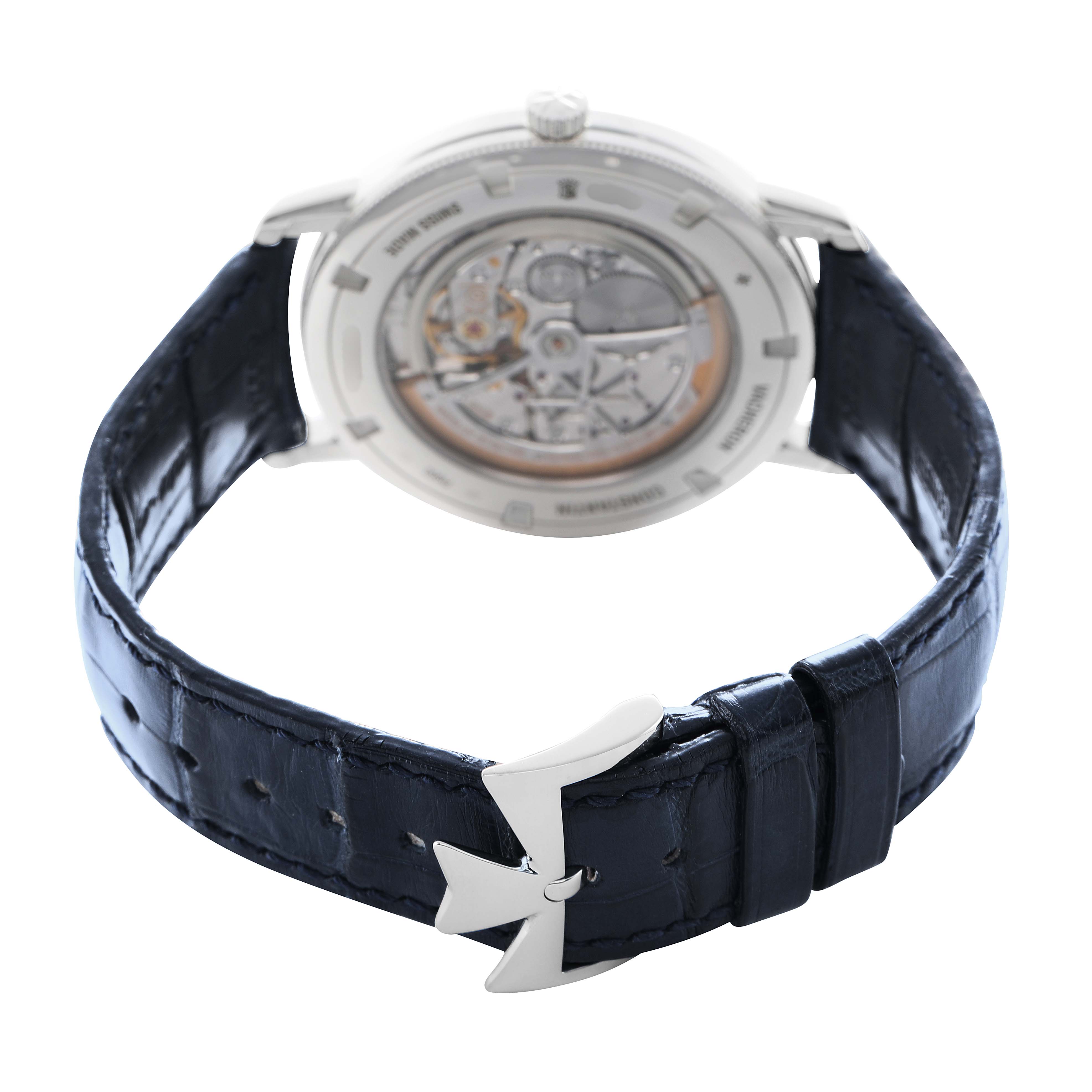 The Vacheron Constantin Traditionnelle 43076 Men's Platinum Silver Dial watch is shown from the back, displaying its movement and the leather strap buckle.