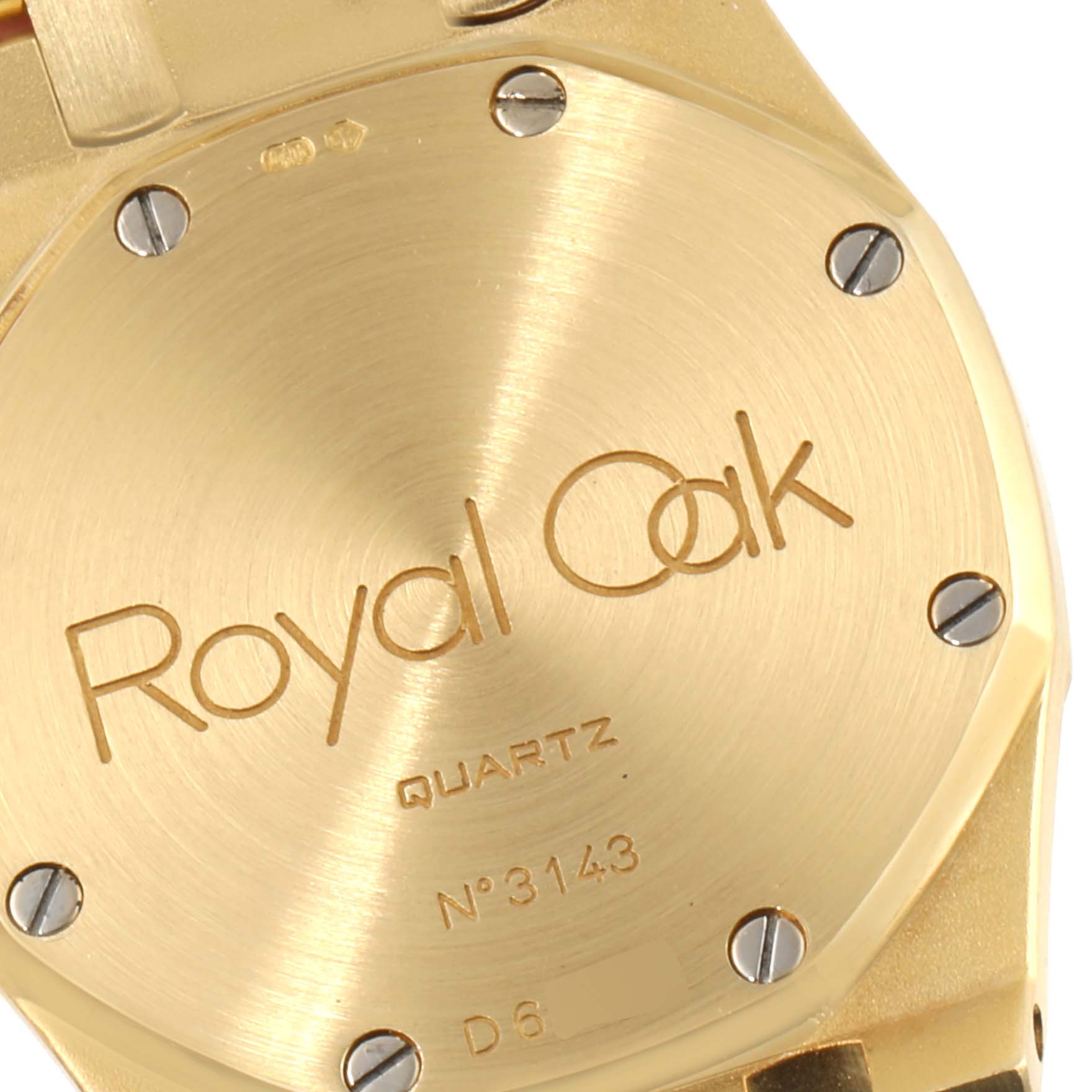 The image shows the case back of an Audemars Piguet Royal Oak  Men's Yellow Gold Champagne Dial  Men's Yellow Gold Champagne Dial watch, highlighting the model engraving and serial number.