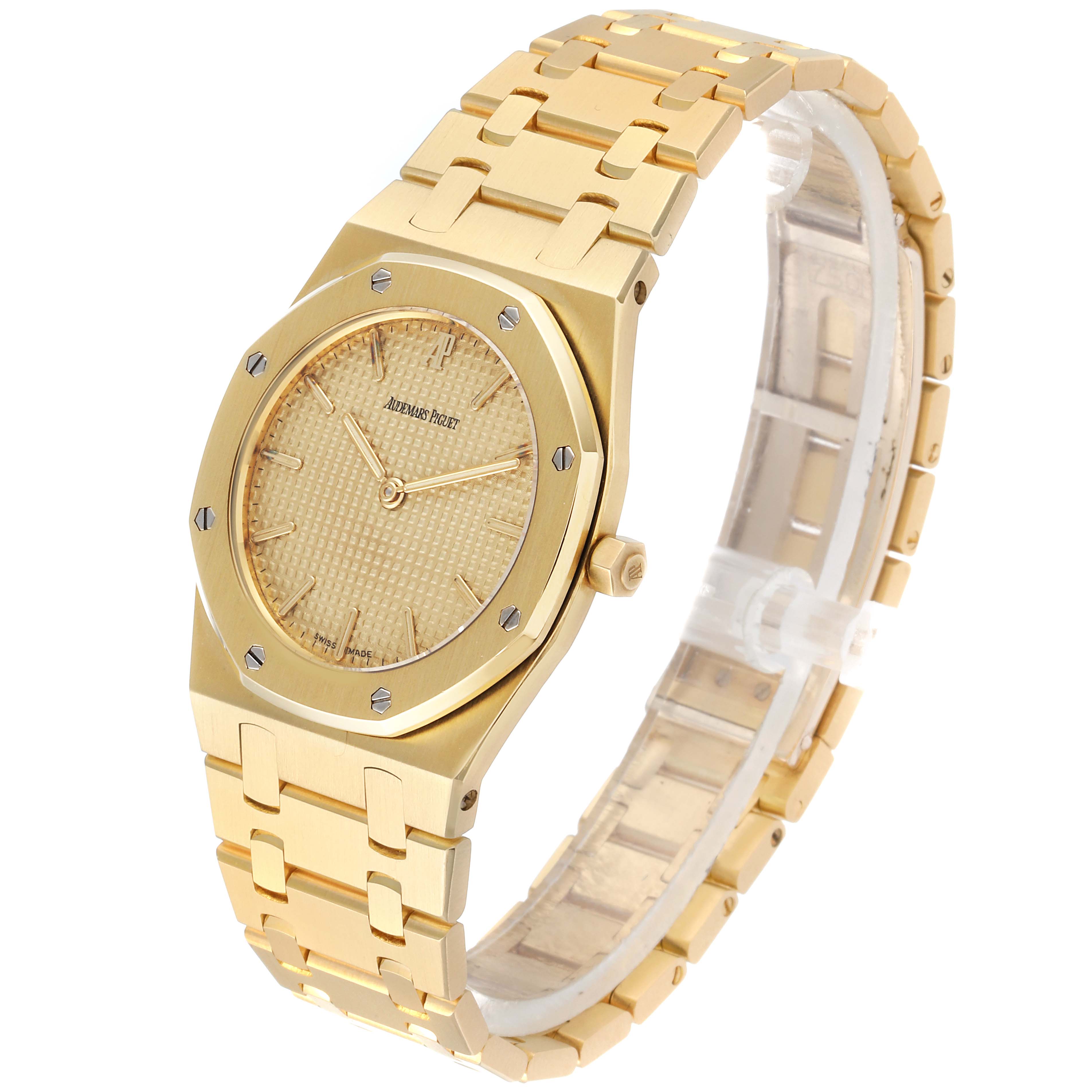 The image shows a side and front angle of the Audemars Piguet Royal Oak  Men's Yellow Gold Champagne Dial  Men's Yellow Gold Champagne Dial watch, highlighting its gold bracelet and face.