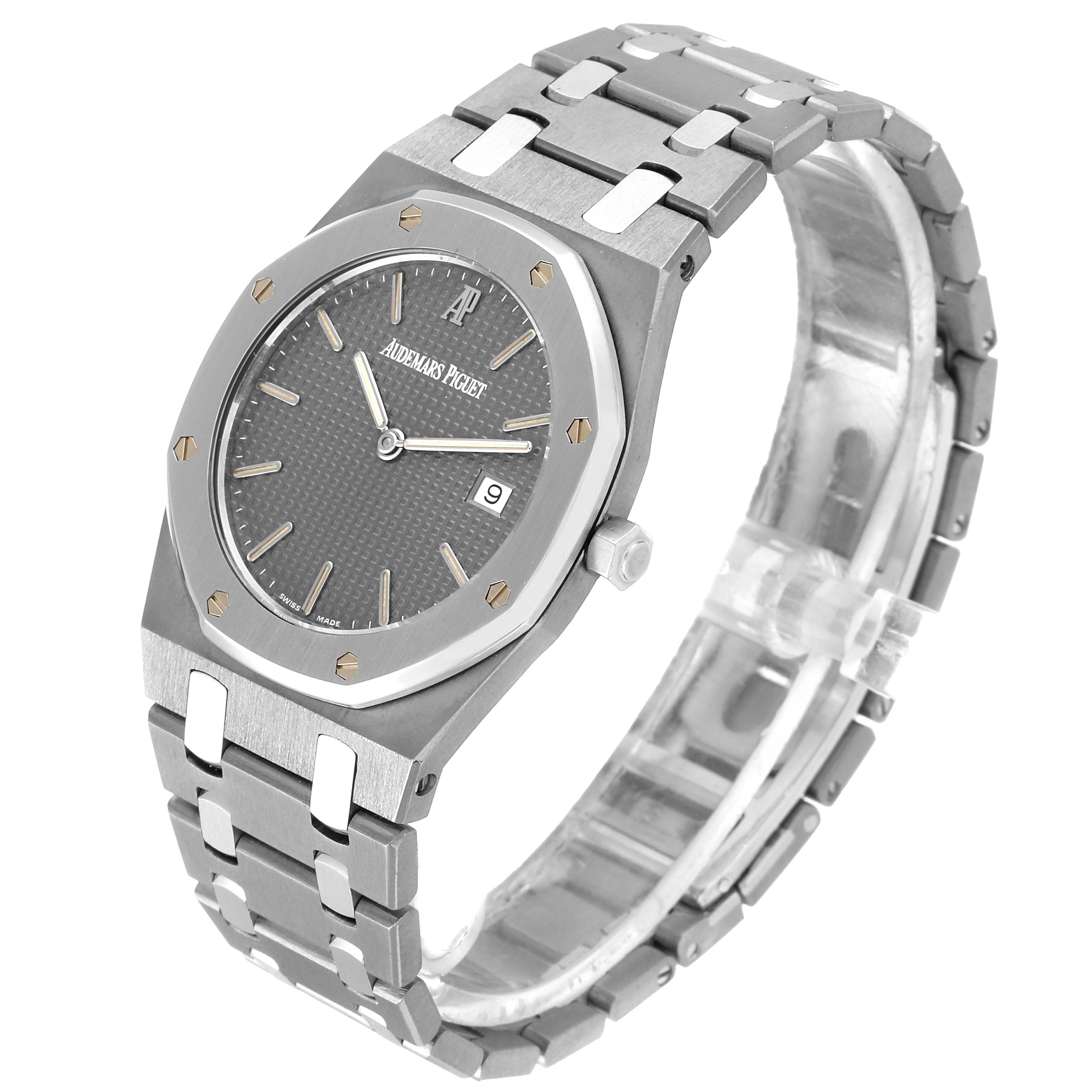 This image shows a Royal Oak model by Audemars Piguet from a three-quarter angle, highlighting its face, bezel, crown, and bracelet.