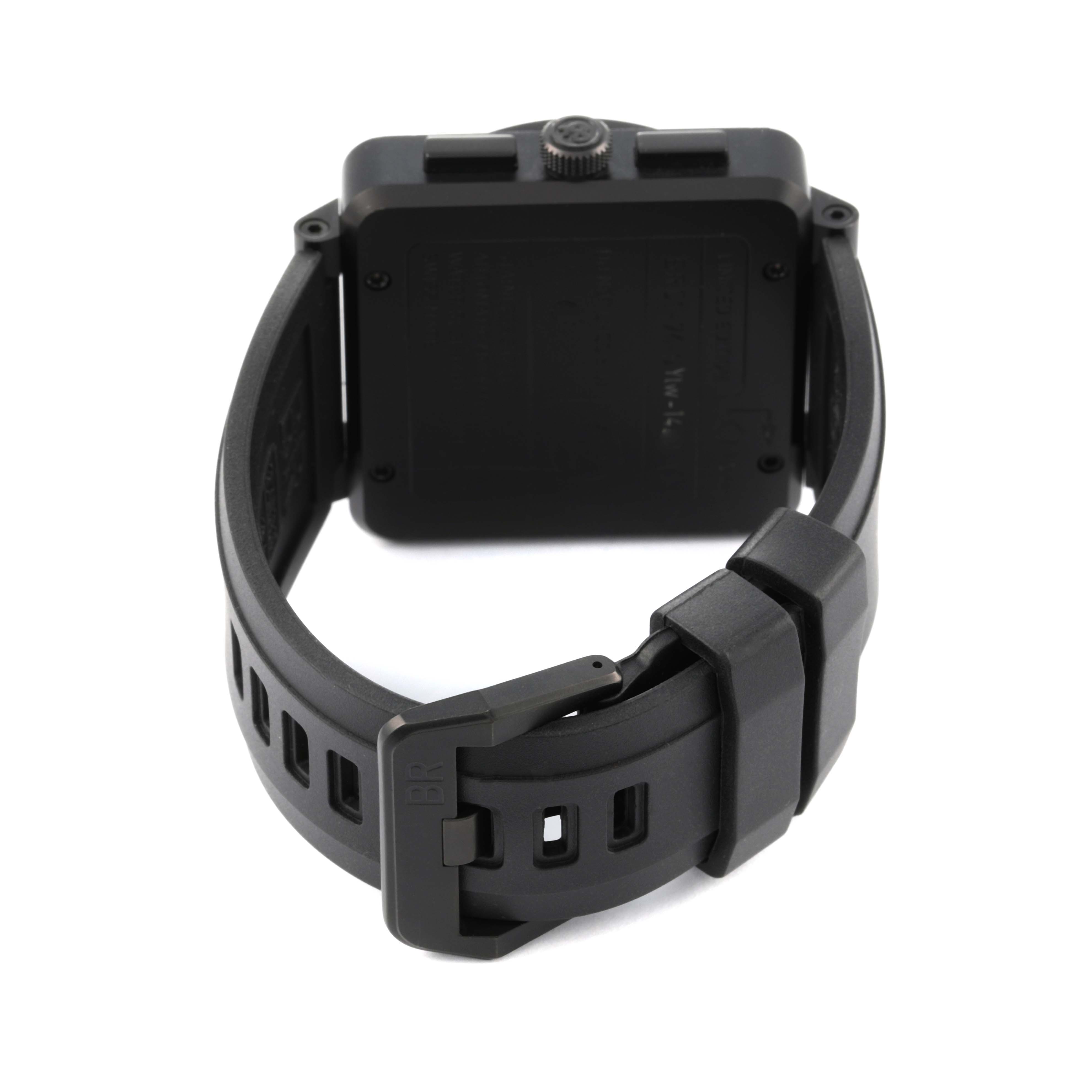 The image shows the back view of the Bell 
Ross Chronograph watch, focusing on the case back and rubber strap with a buckle.