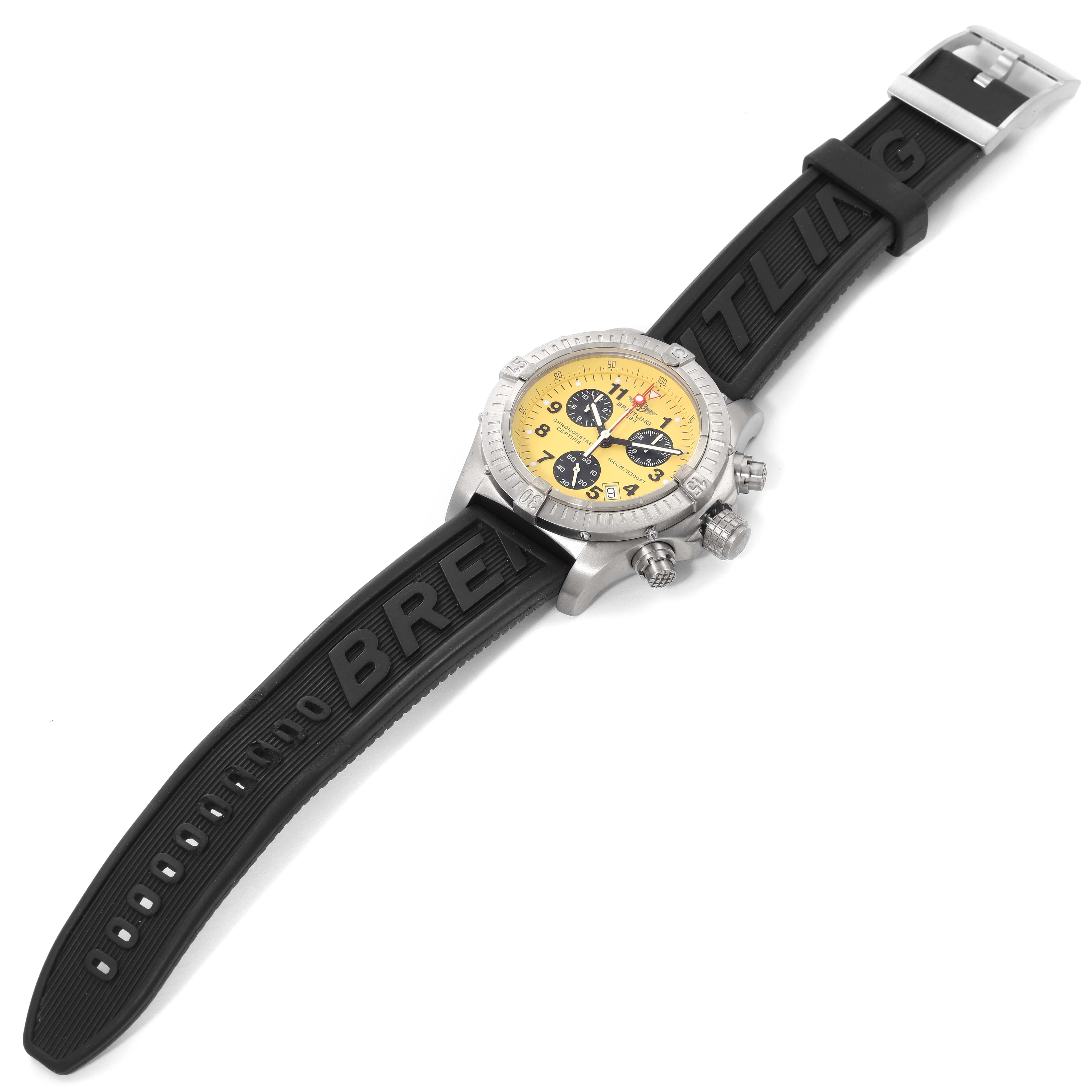 The Breitling Avenger E73360 Men's Titanium Yellow Dial E73360 Men's Titanium Yellow Dial watch is shown at an overhead angle, displaying its yellow dial, black rubber strap, and side buttons.