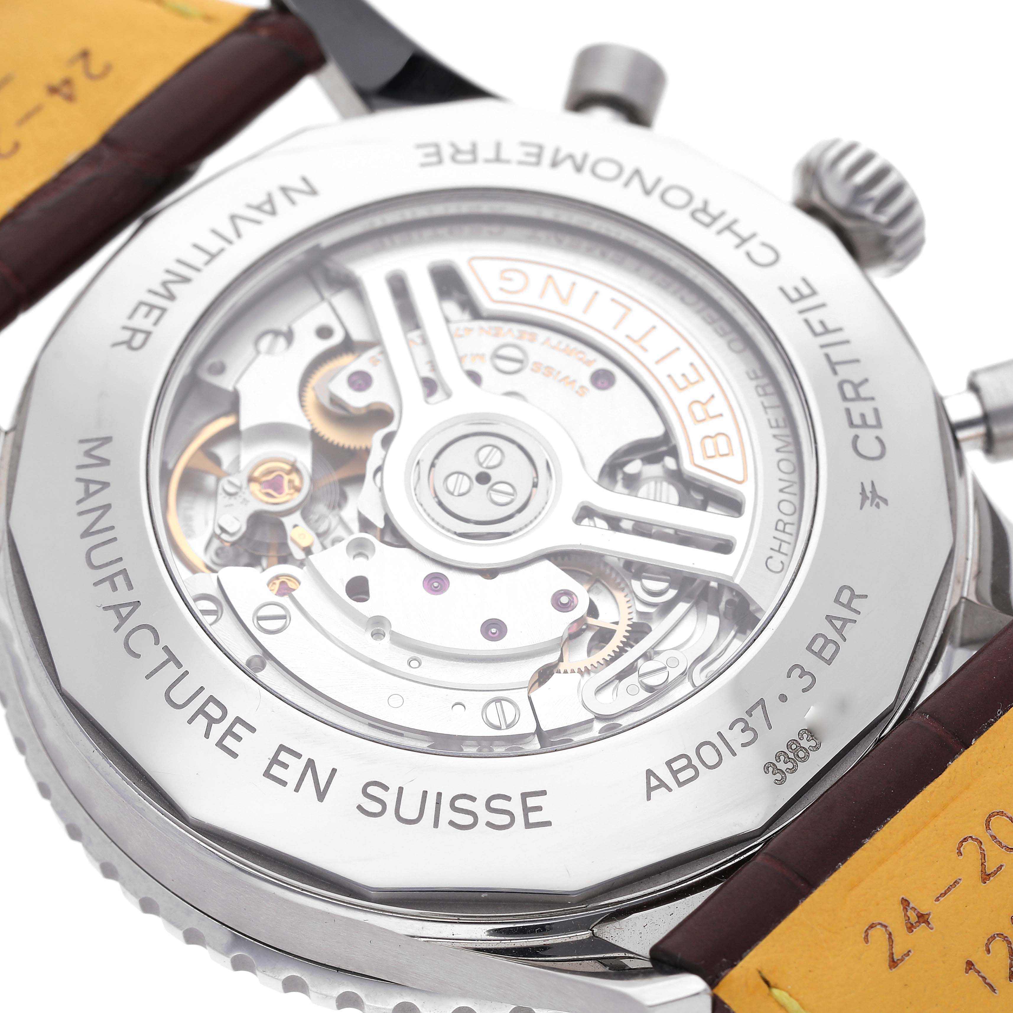 The image shows the back of a Breitling Navitimer AB0137 Men
s Stainless Steel Blue Dial AB0137 Men
s Stainless Steel Blue Dial watch displaying its mechanical movement through a transparent case back.