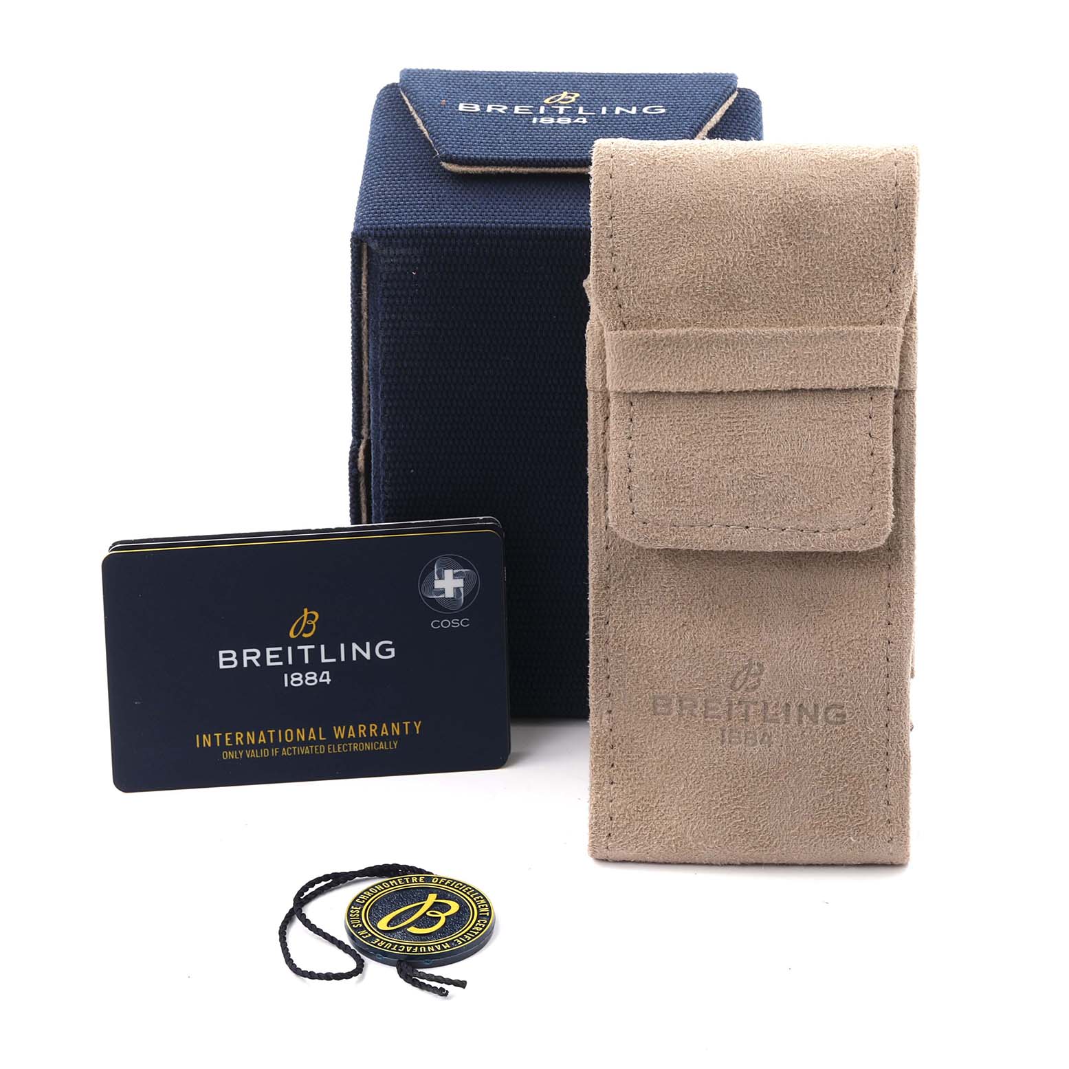 The image shows accessories for the Breitling Superocean A17367 Men's Stainless Steel Black Dial A17367 Men's Stainless Steel Black Dial watch, including a box, a suede pouch, warranty cards, and a tag.