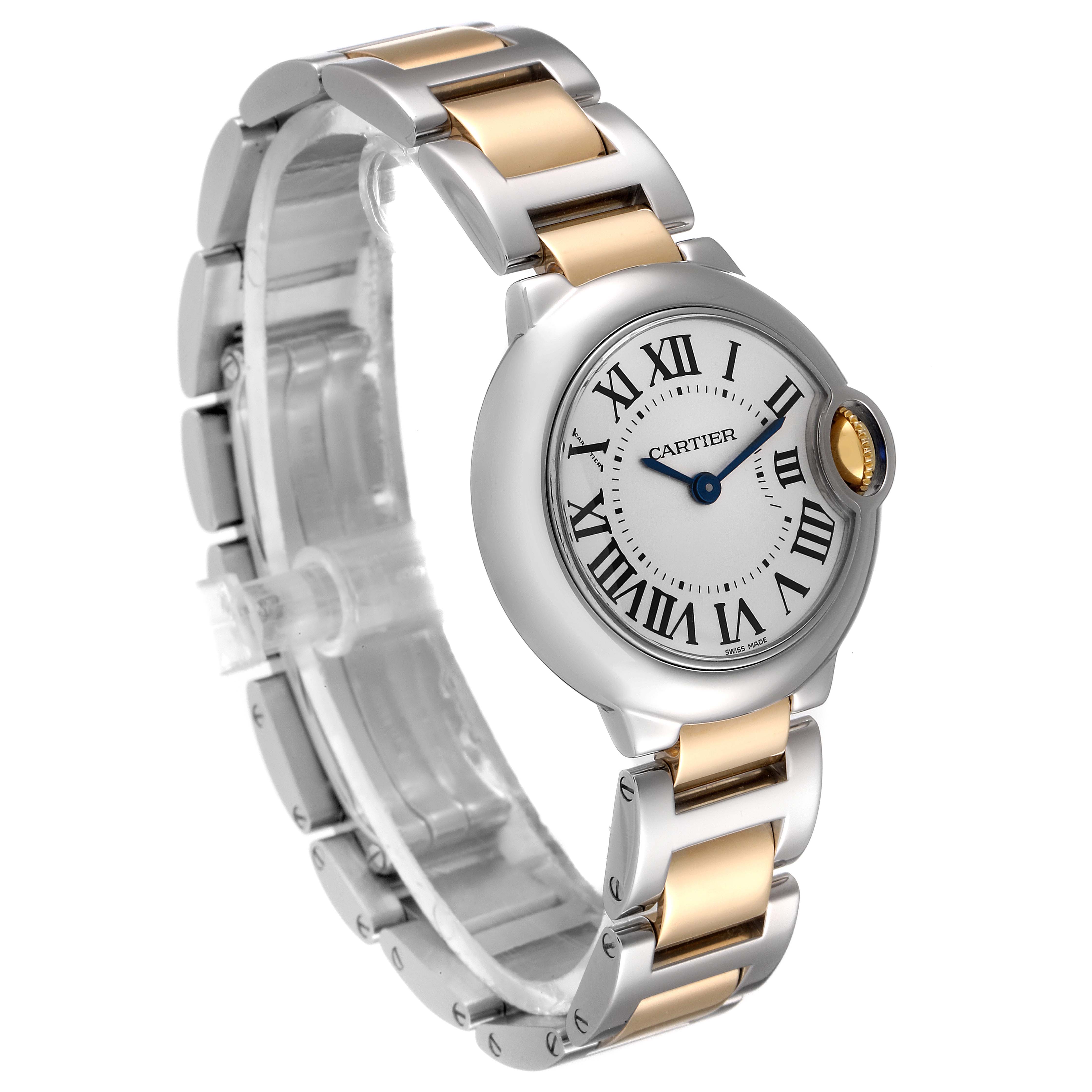 This image shows a Ballon Bleu model by Cartier at a slight angle, displaying the watch face, bezel, crown, and two-tone bracelet.
