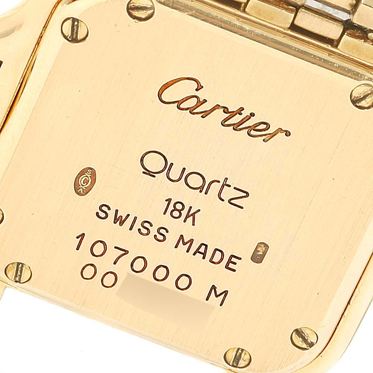 This image shows the back case of the Cartier Panthere W25022B9 Women
s Yellow Gold Silver Dial W25022B9 Women
s Yellow Gold Silver Dial watch, displaying its engravings and part of the gold bracelet.