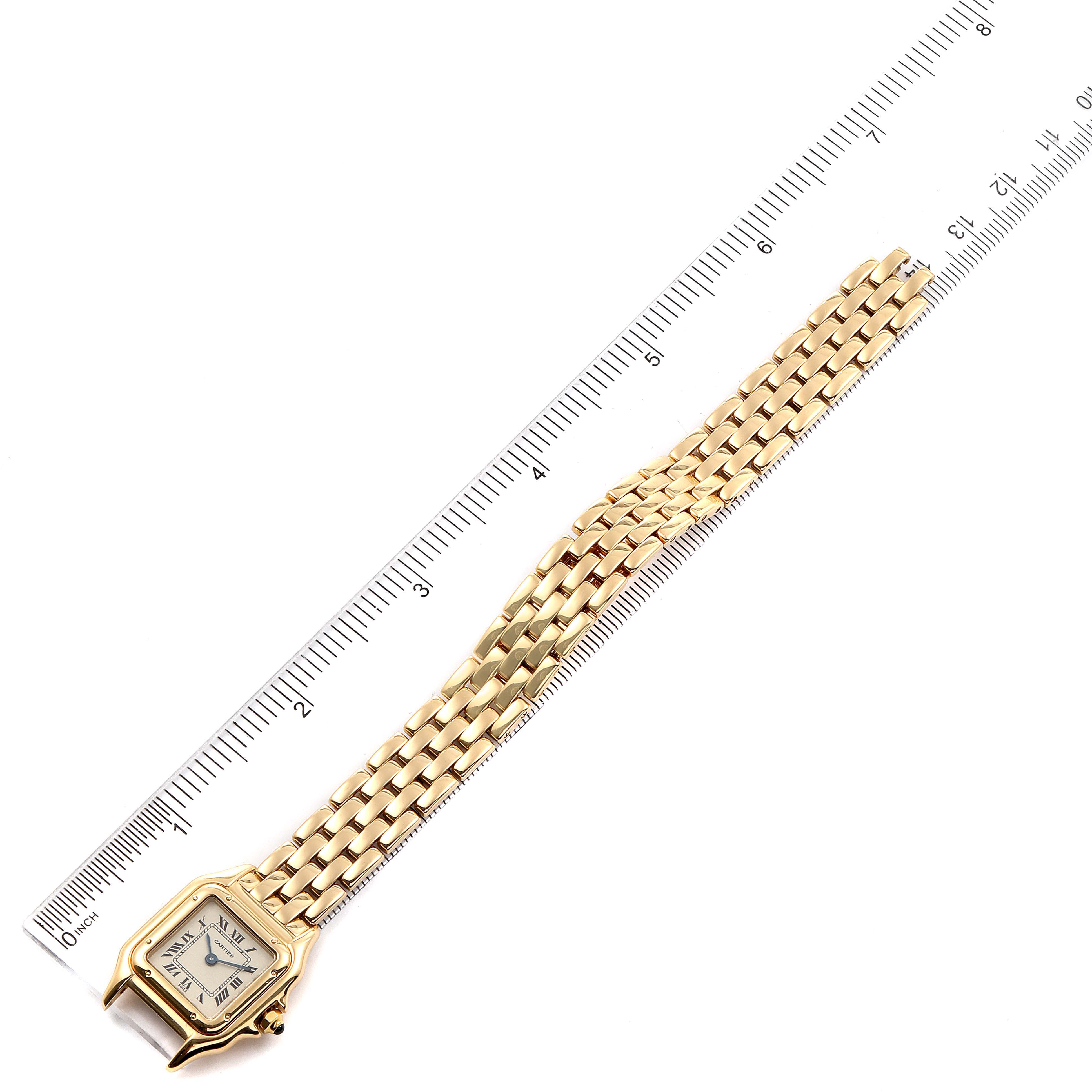 The image shows the Panthère de Cartier watch laying flat with its strap extended next to a ruler for measurement.