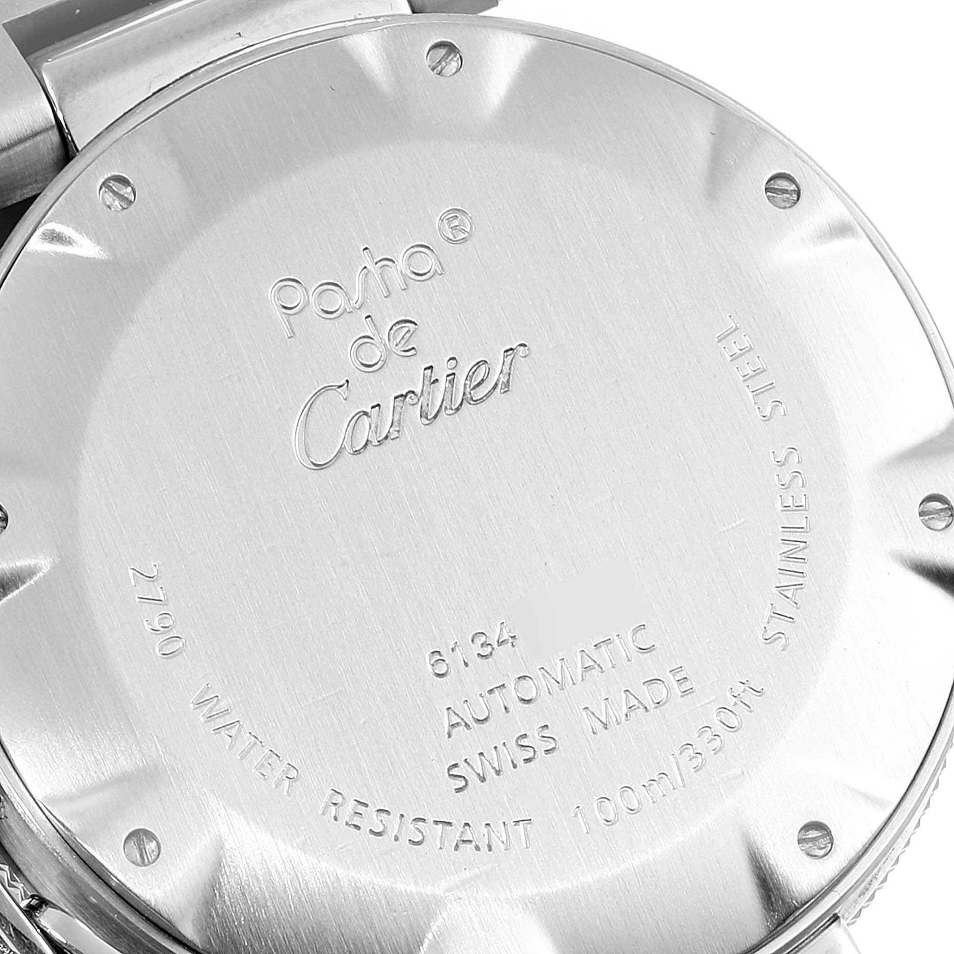The image shows the back case of a Pasha de Cartier watch, highlighting the engraved details and screws.